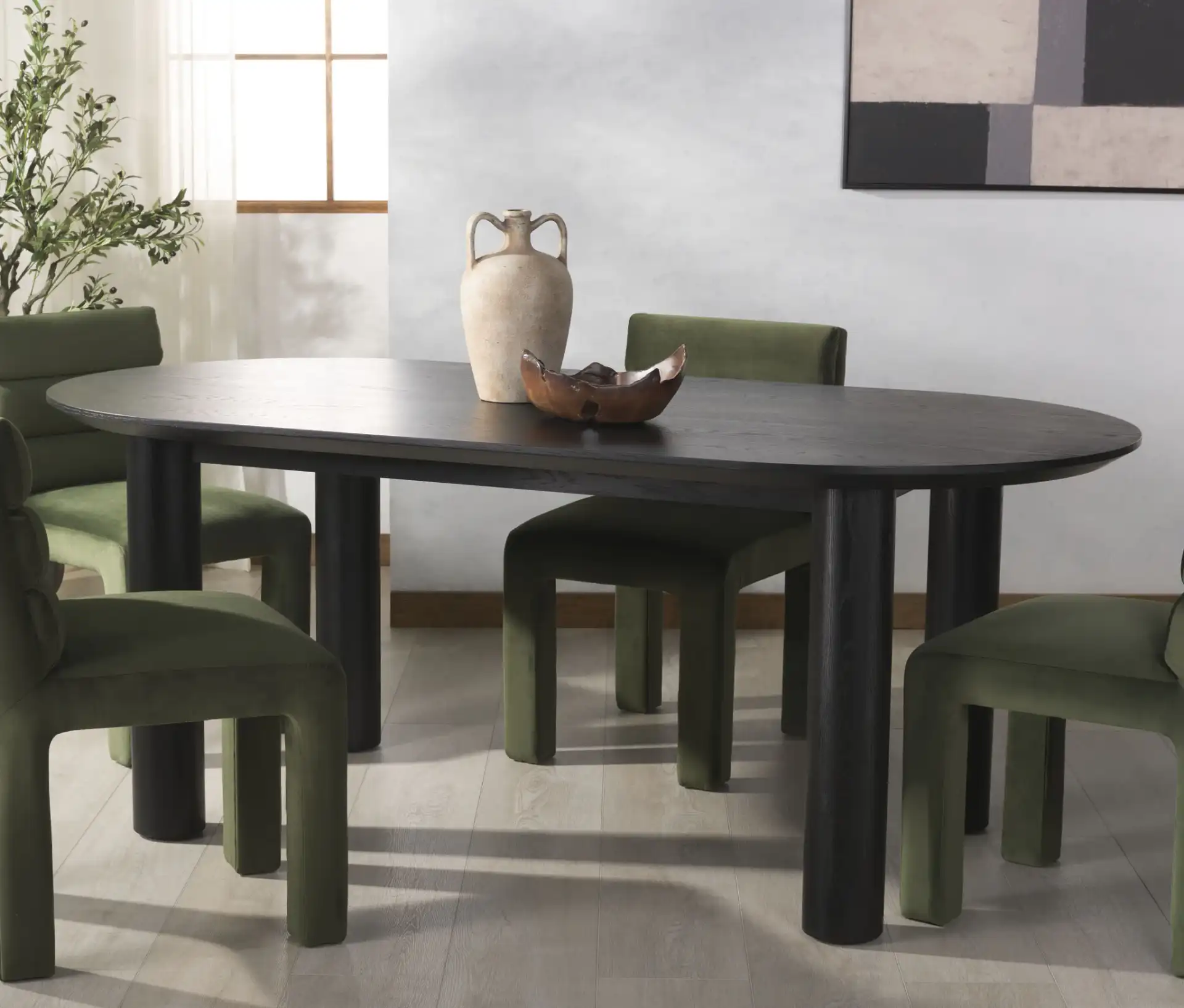 Sofiette Oval Dining Table in Black in a styled room