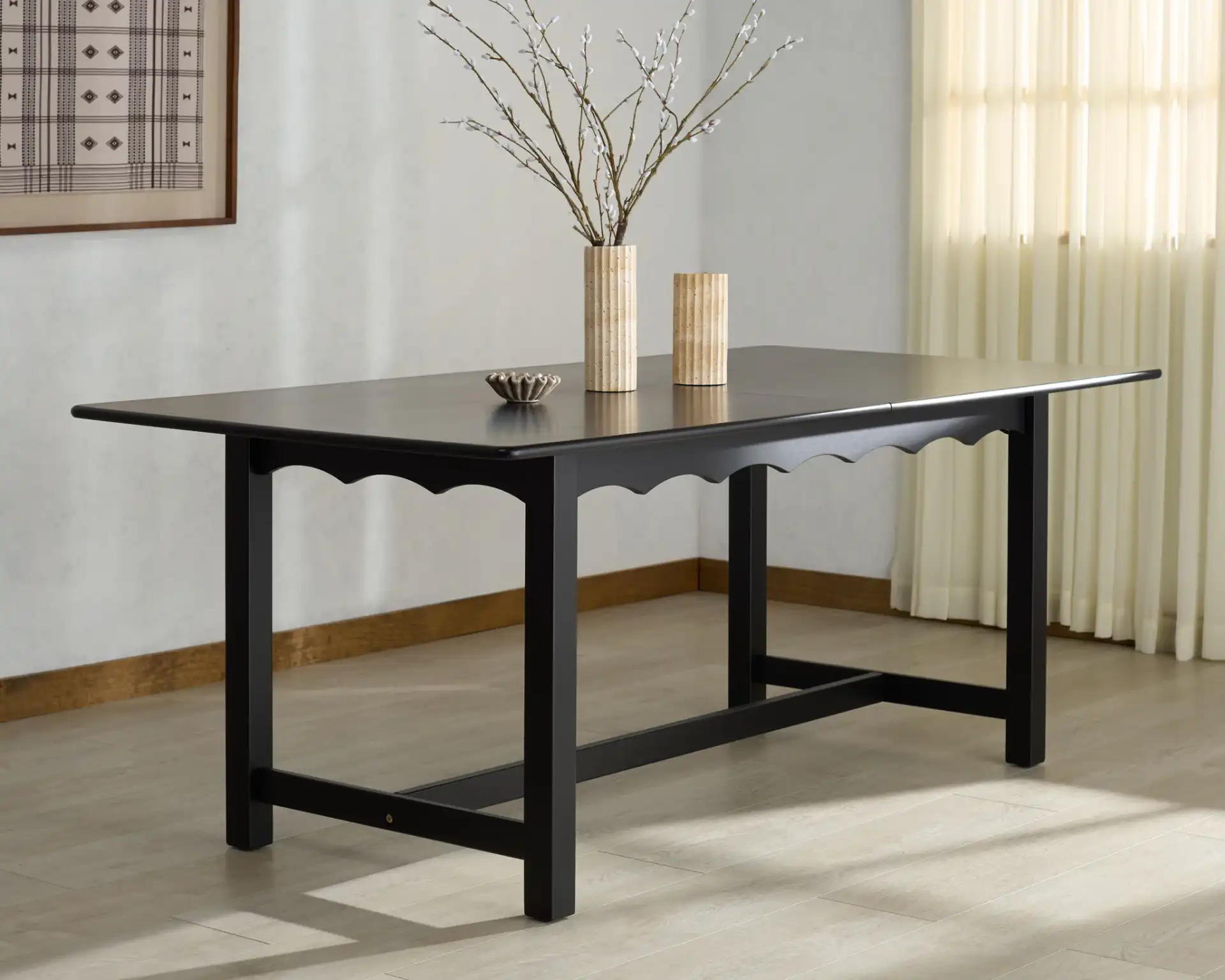 Rhylee Extendable Dining Table in Black in a styled room