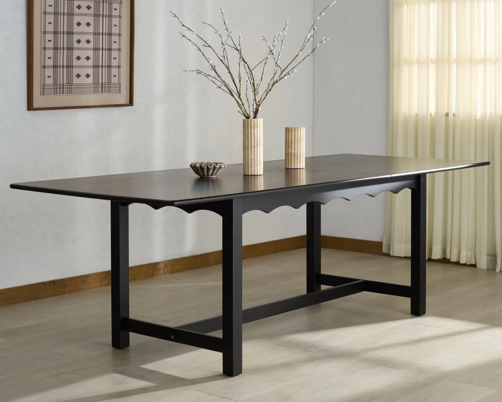 Rhylee Extendable Dining Table in Black in a styled room