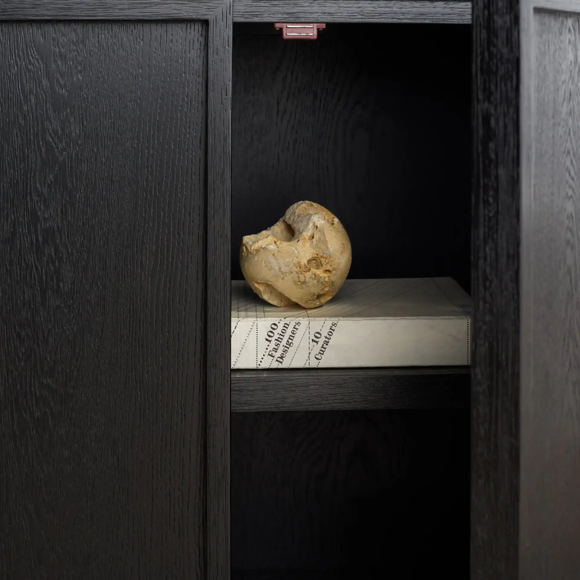Zeus Four-Shelf Wood Bookcase in Black in a styled room