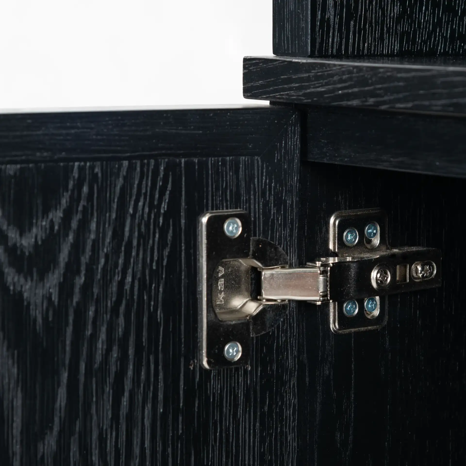 Zeus Four-Shelf Wood Bookcase in Black in a styled room