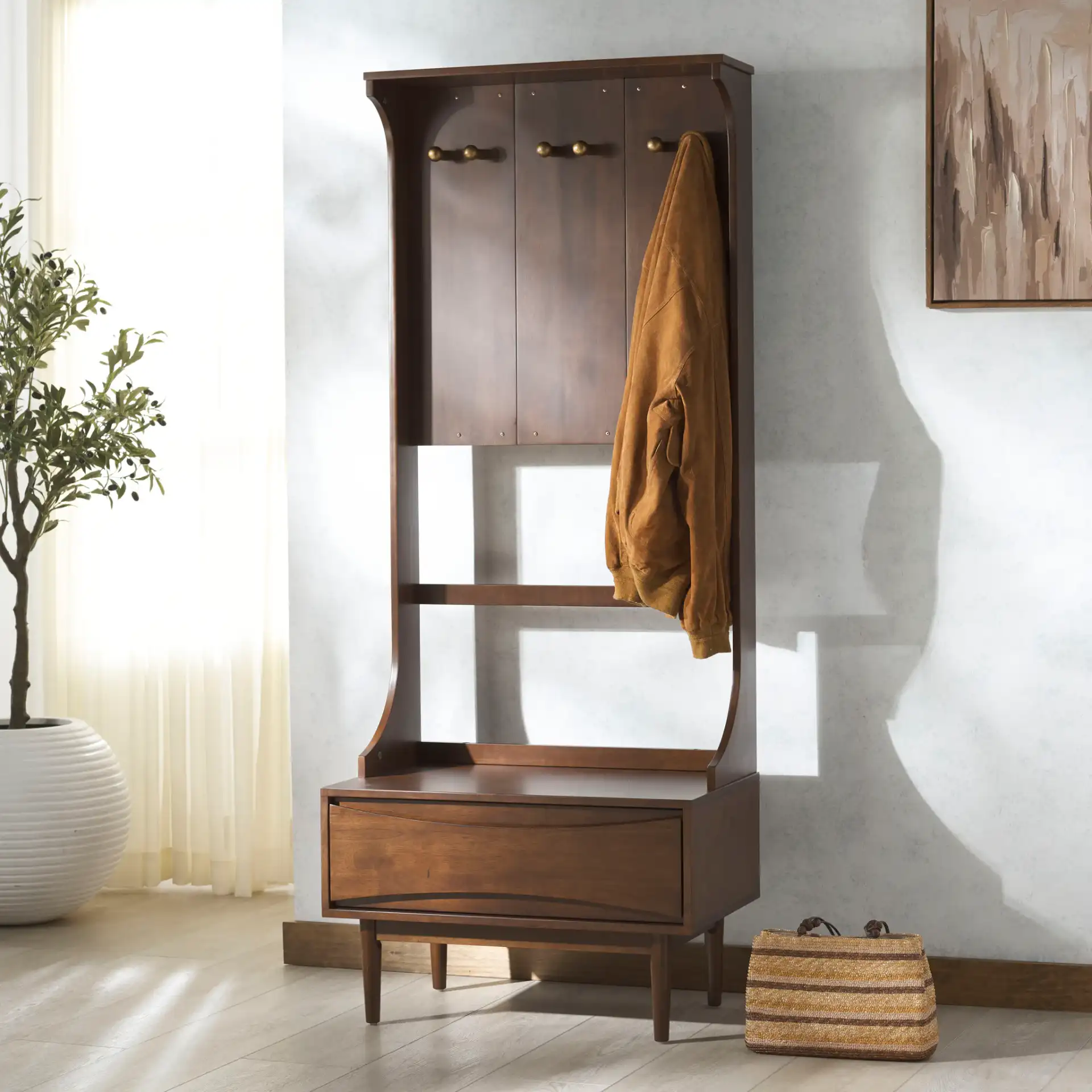Pitta Wood One-Drawer Hall Tree in Walnut / Gold in a styled room