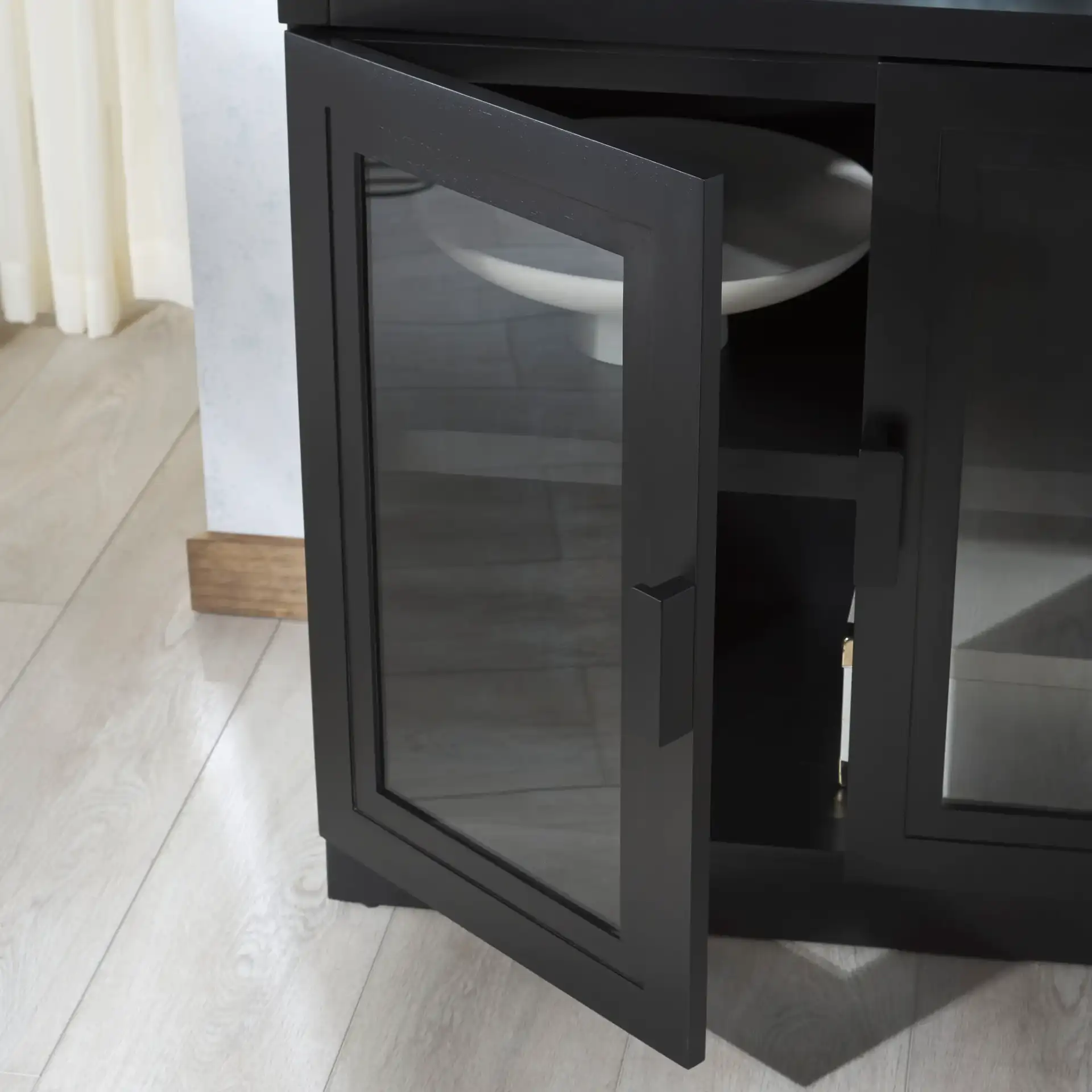 Roades Glass Cabinet Bookcase in Black in a styled room
