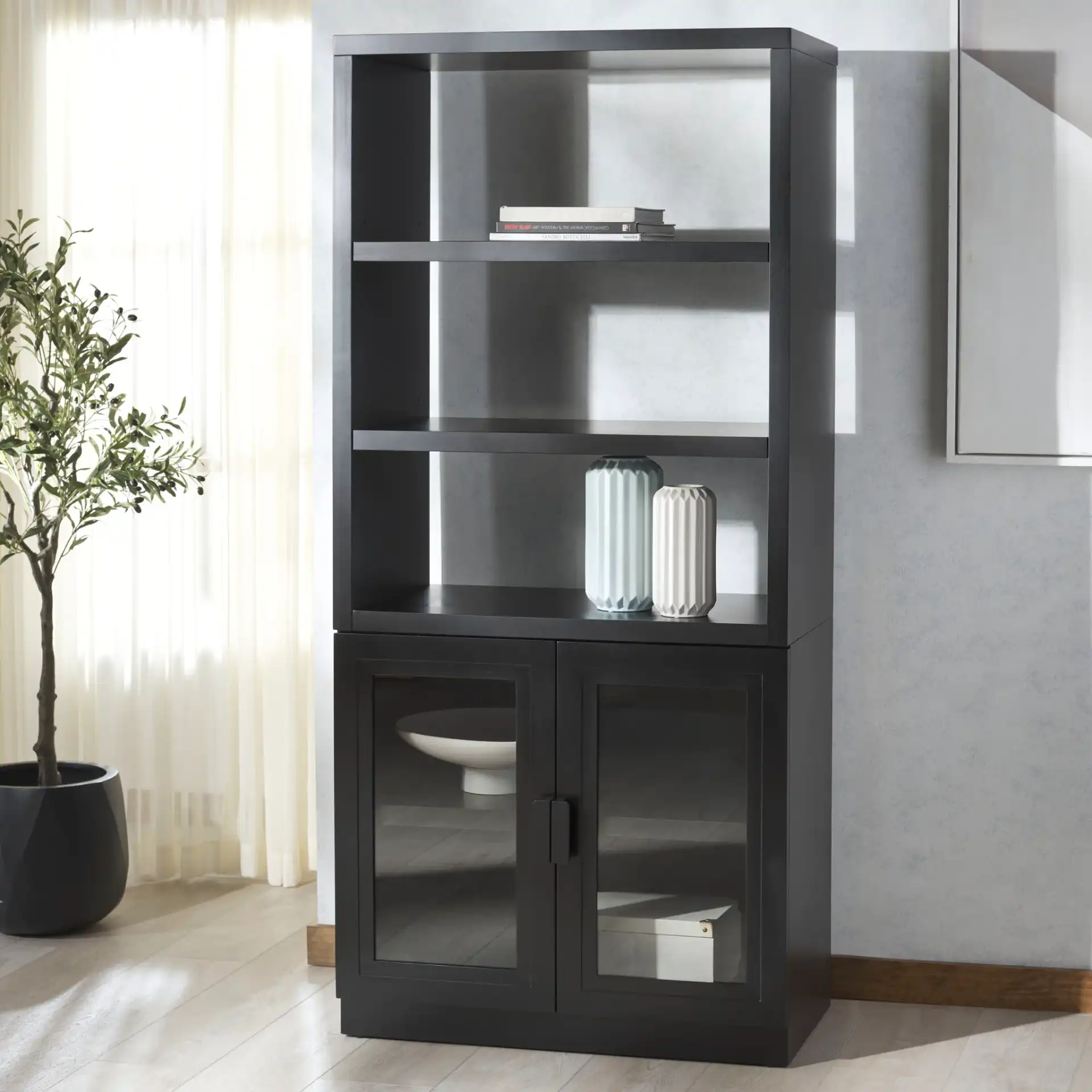 Roades Glass Cabinet Bookcase in Black in a styled room