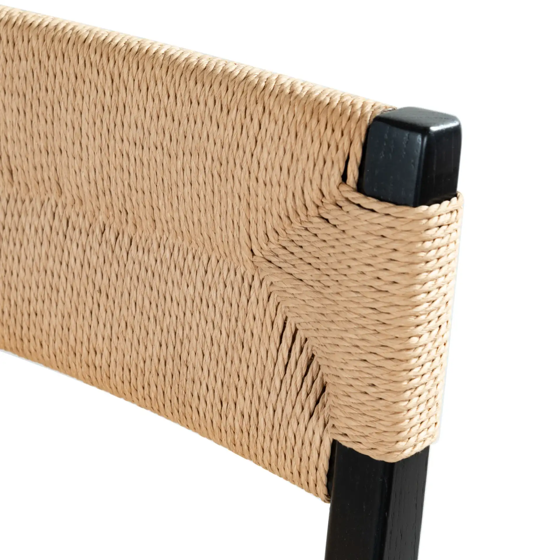 Cody Rattan Barstool in Black / Natural in a styled room