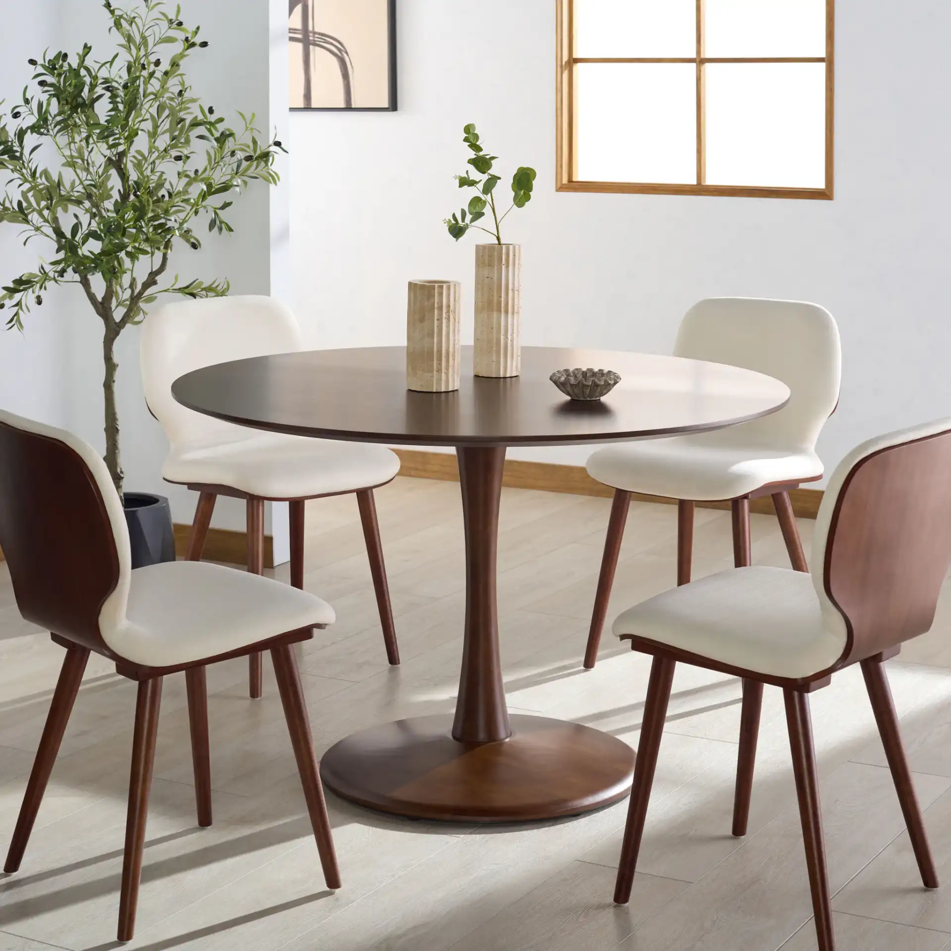 Lisette Round Dining Table in Walnut in a styled room