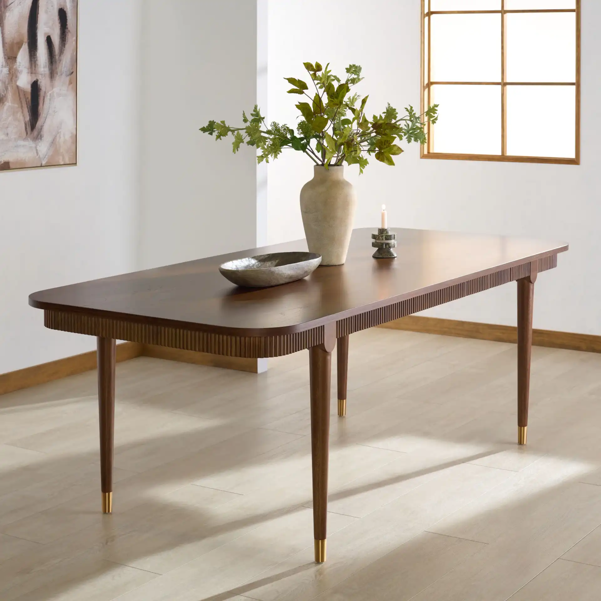 Kaylenne 90" Dining Table in Walnut / Brass in a styled room