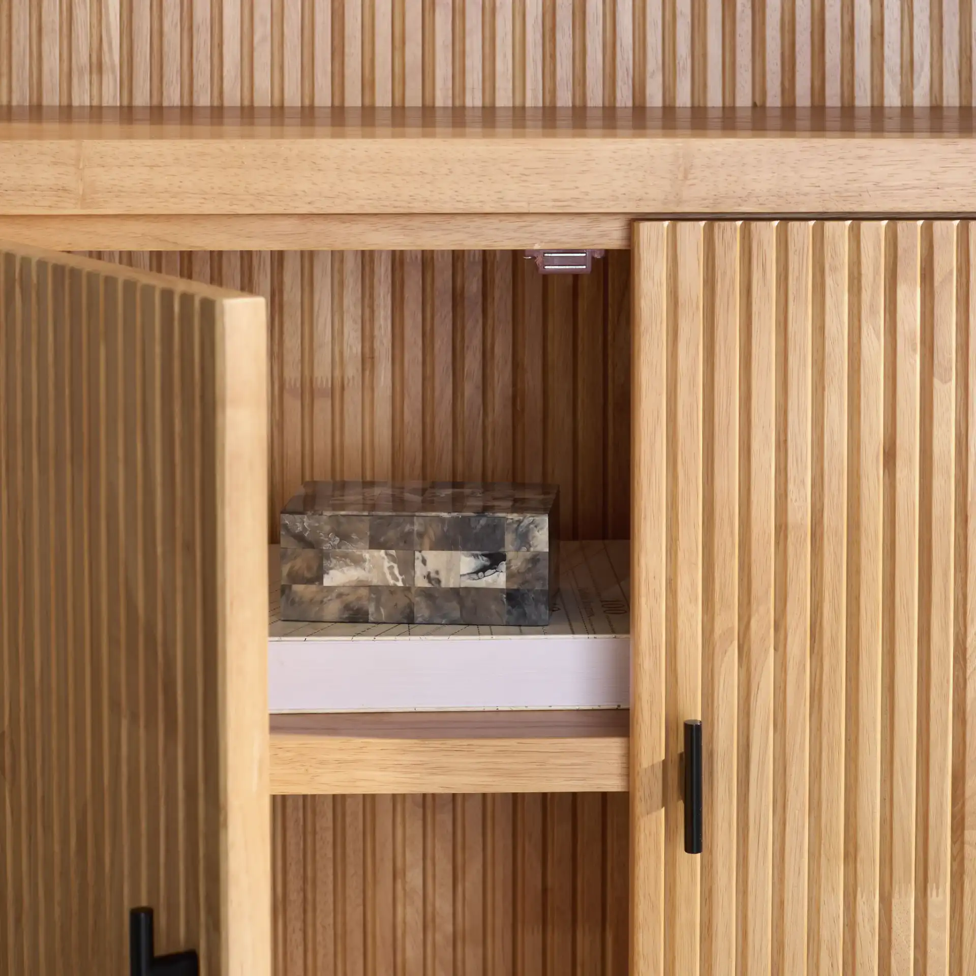 Elladora Ribbed Wood Bookcase in Natural / Black in a styled room