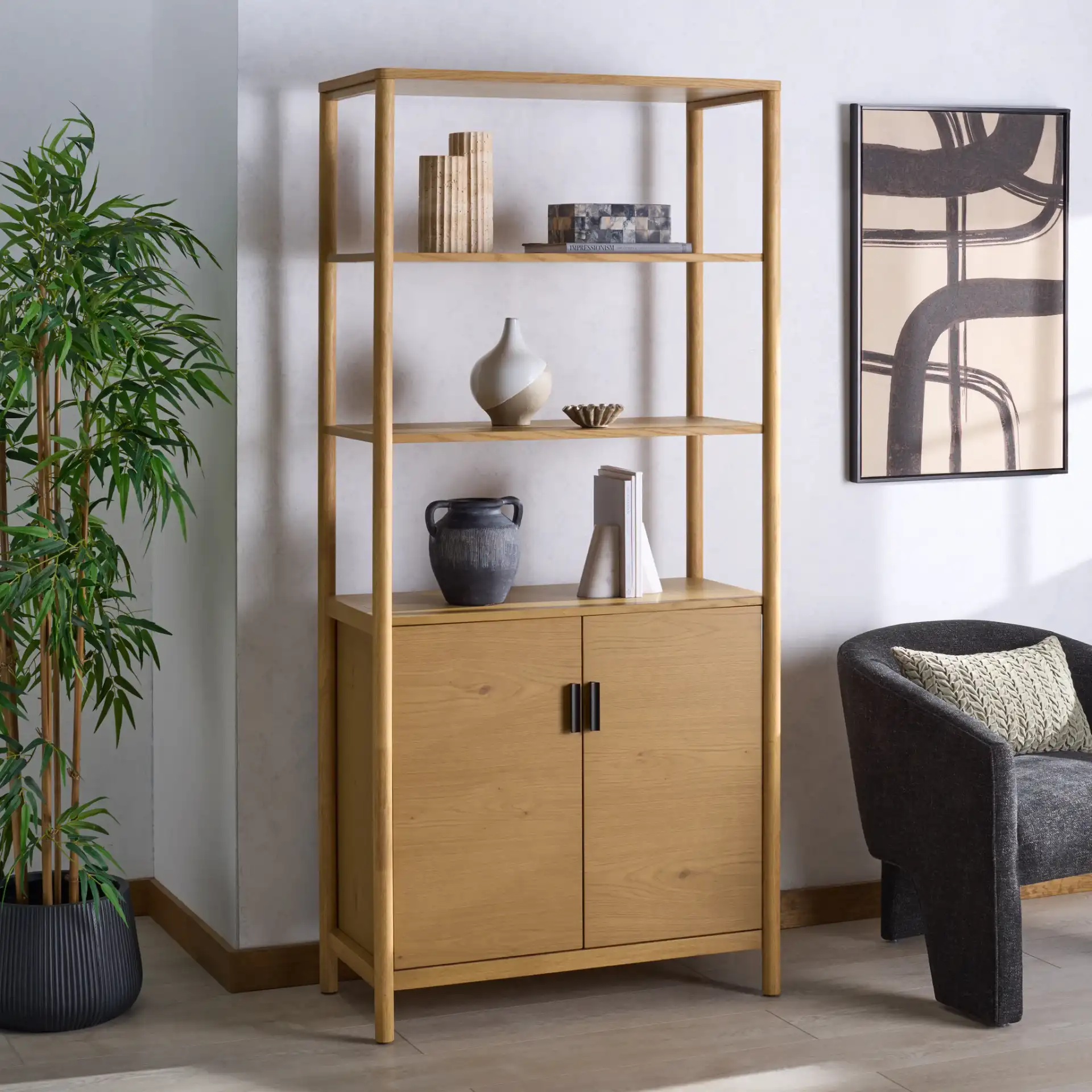Jaylessa 5 Shelf Wood Bookcase in Natural in a styled room