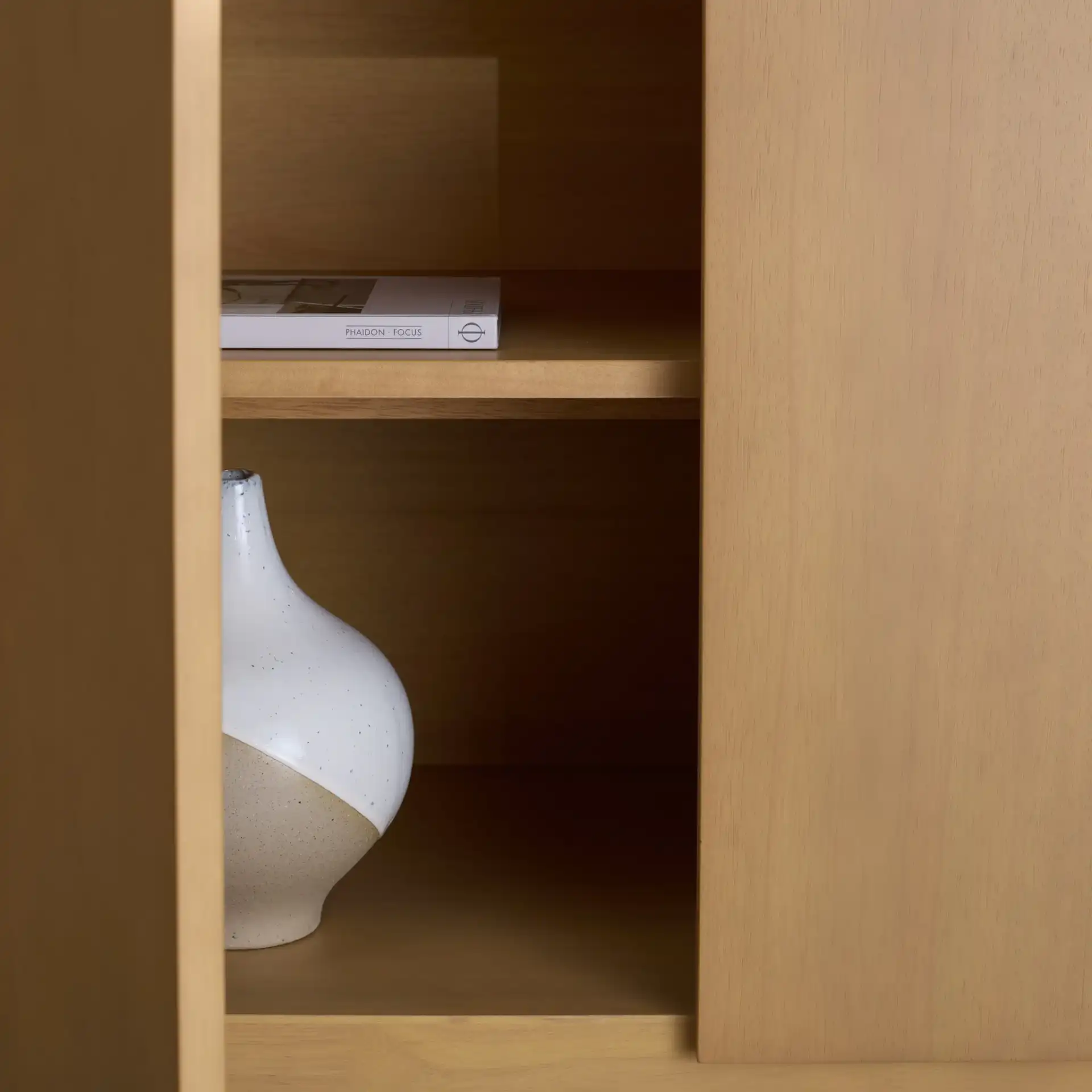 Rhylee Four-Door Wood Sideboard in Natural in a styled room