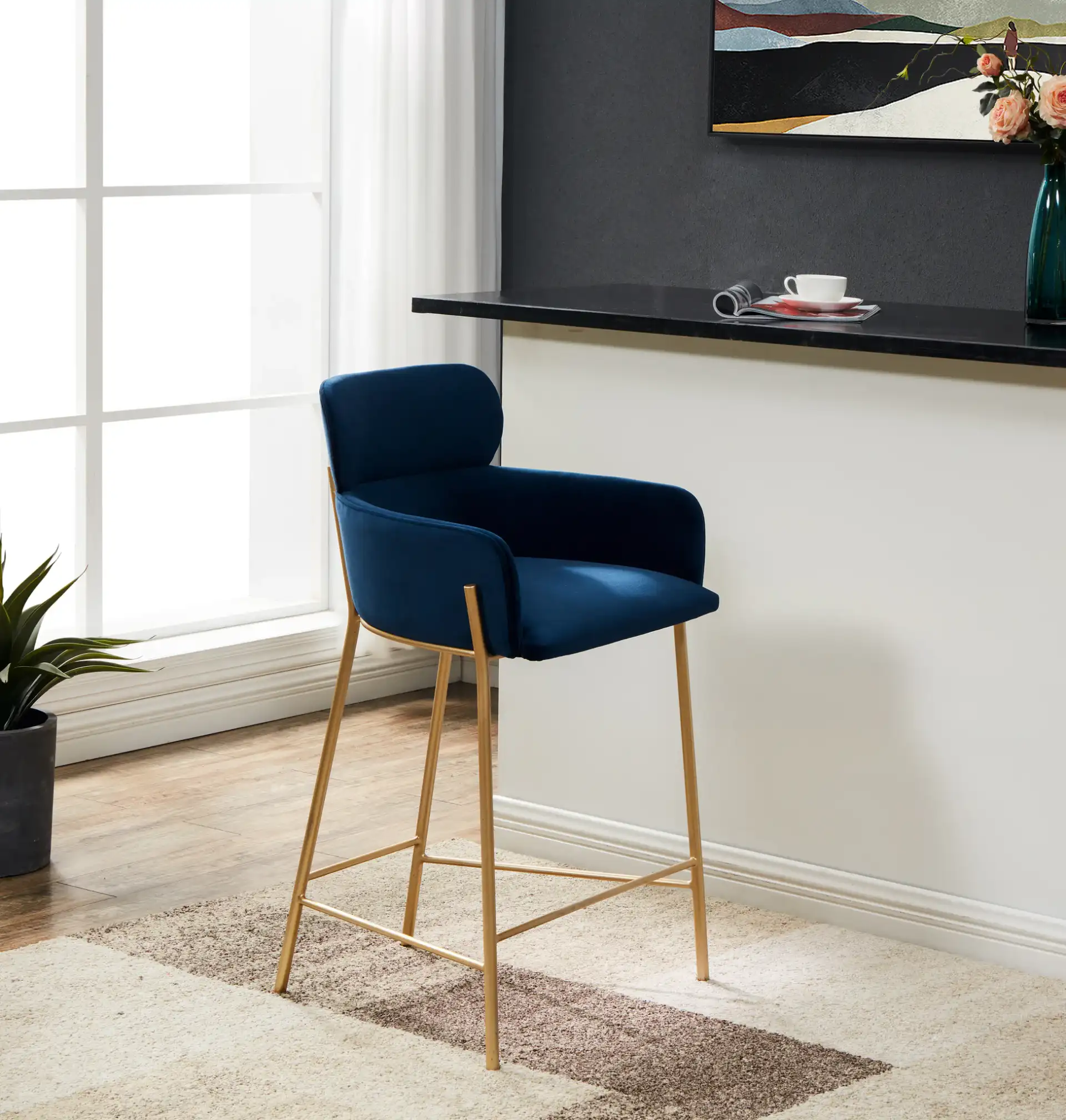 Charlize Velvet Counter Stool in Dark Gray / Gold in a styled room