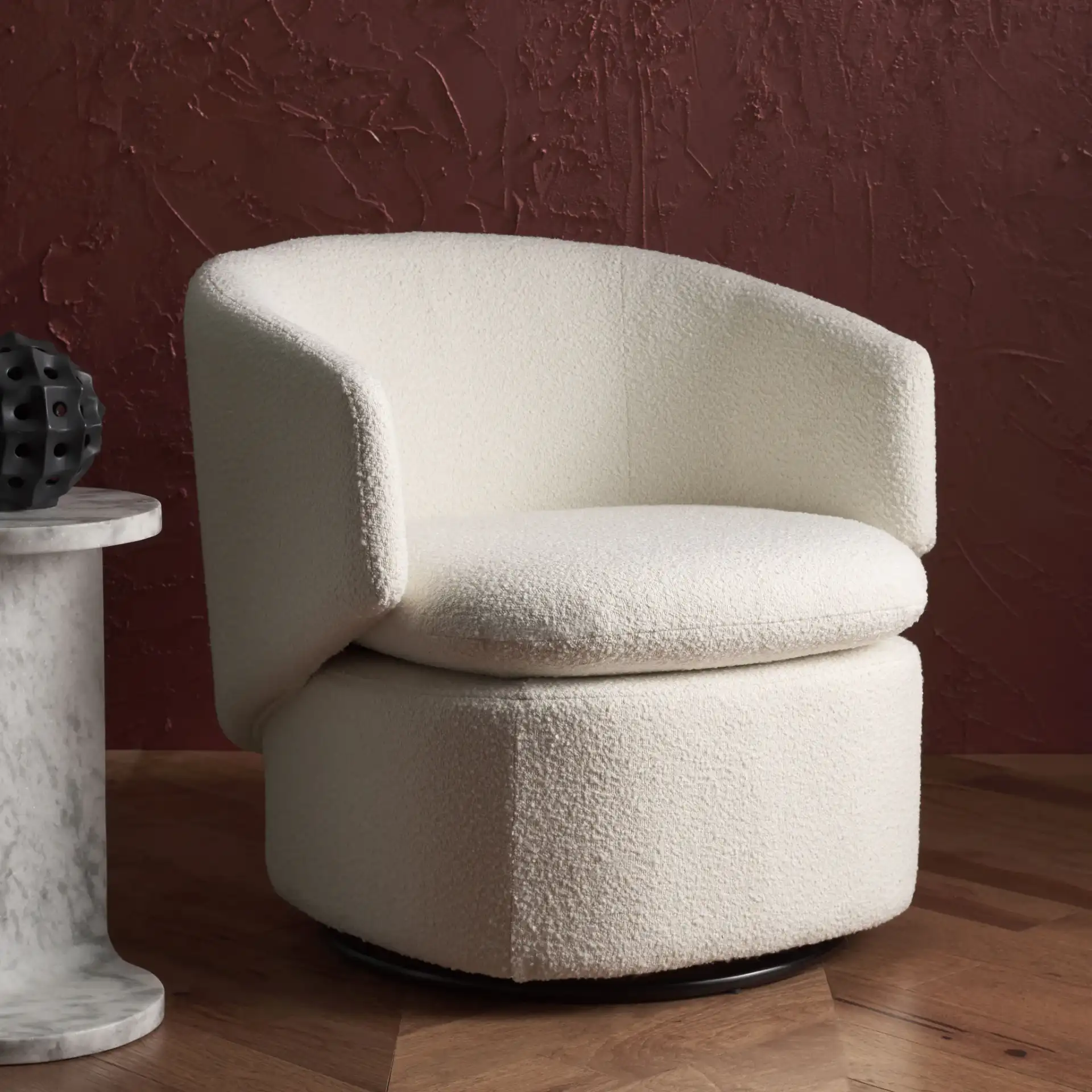 Phyllis Boucle Swivel Chair in Black in a styled room