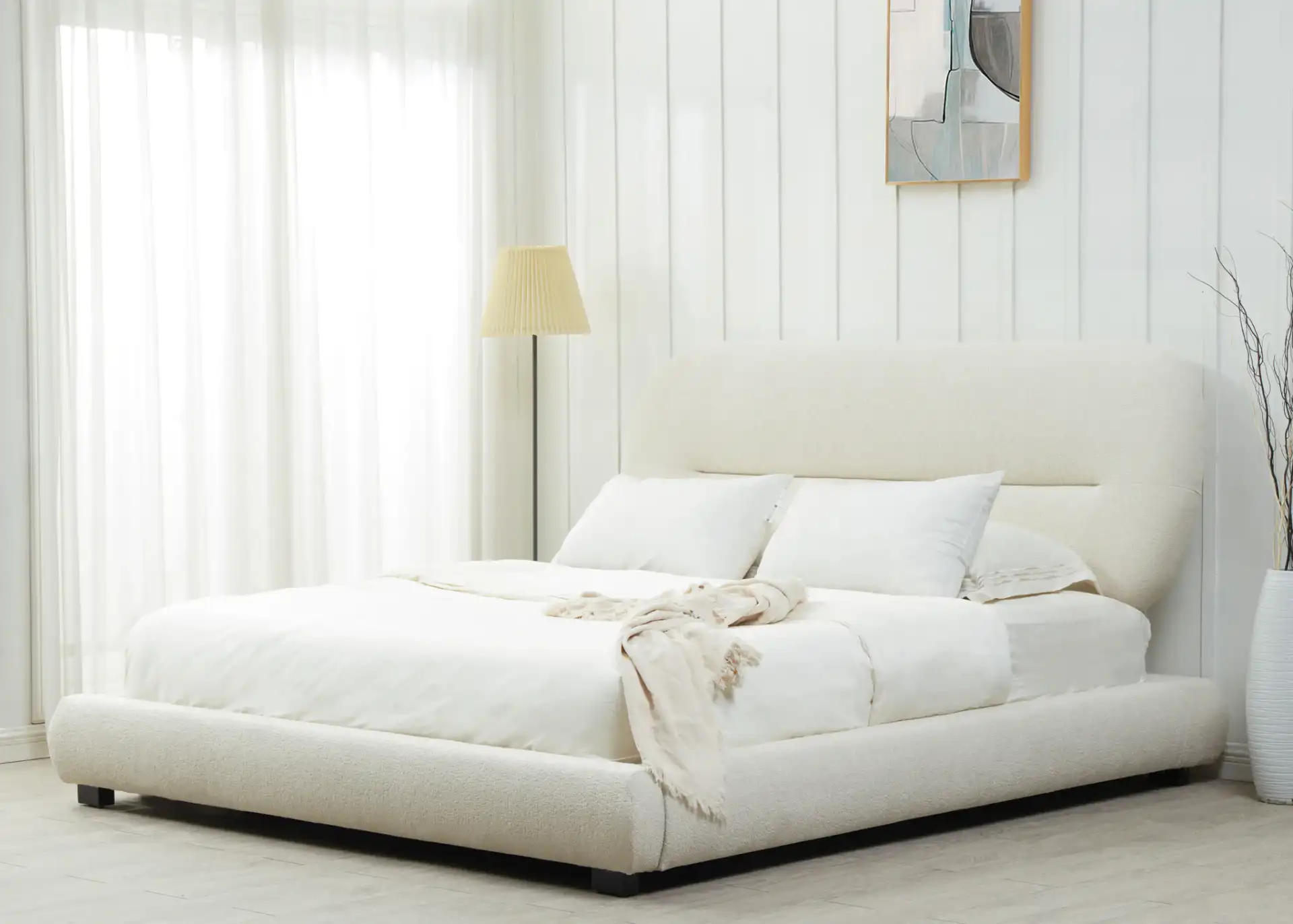 Thalia Oval Headboard Bed in Cream in a styled room