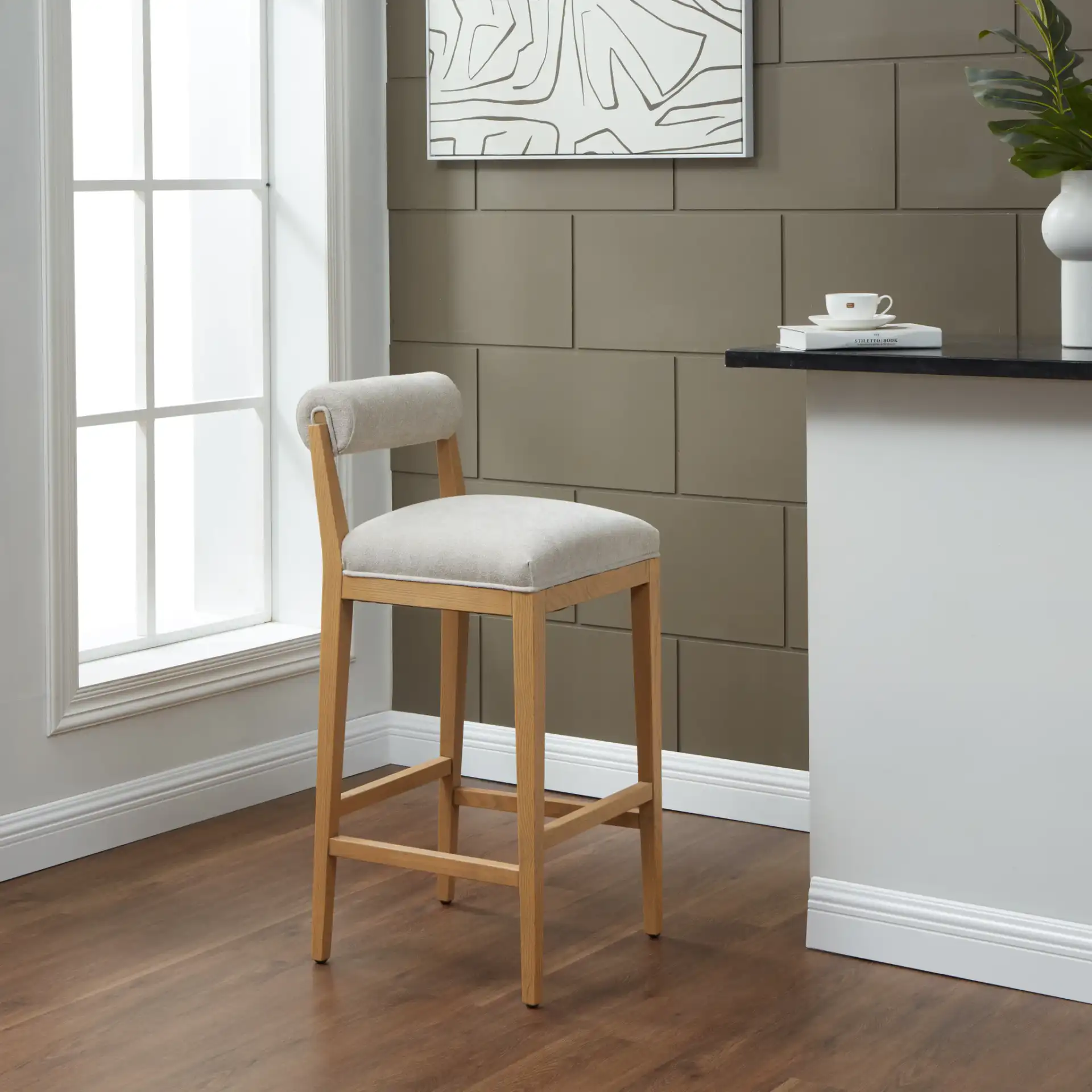 Oaklie Rolled Back Barstool in Taupe / Natural in a styled room