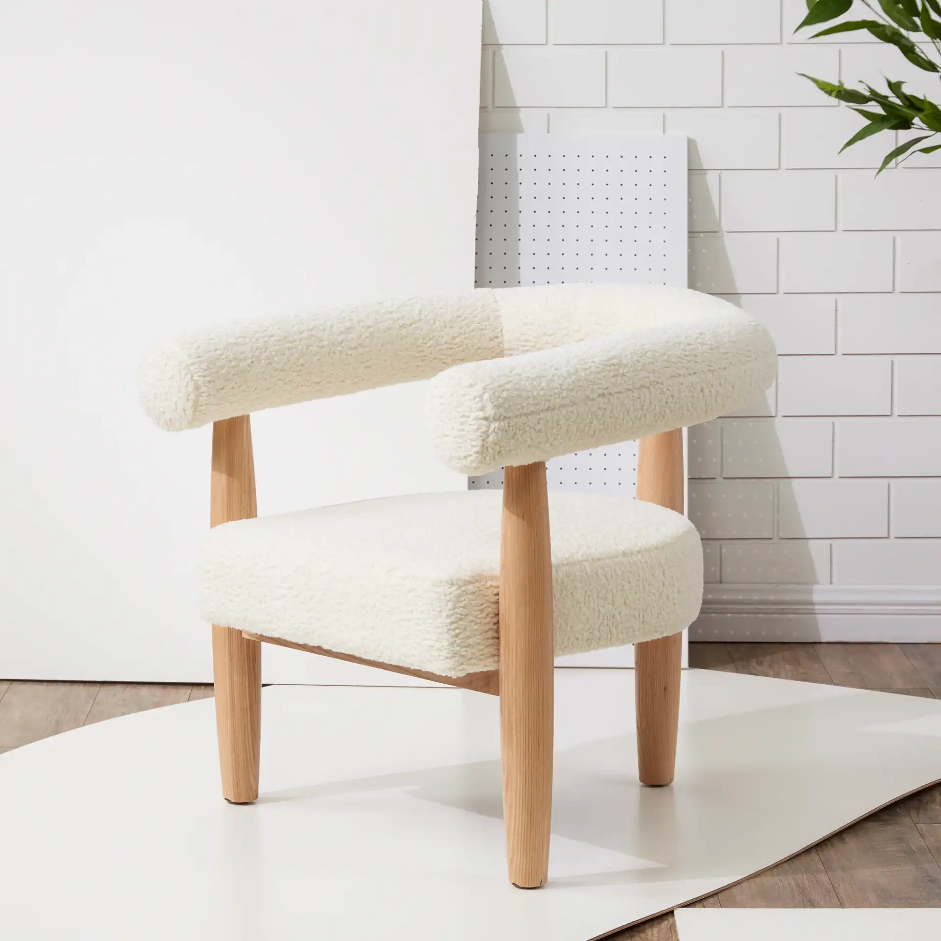 Jackie Curved Back Accent Chair in White / Black in a styled room