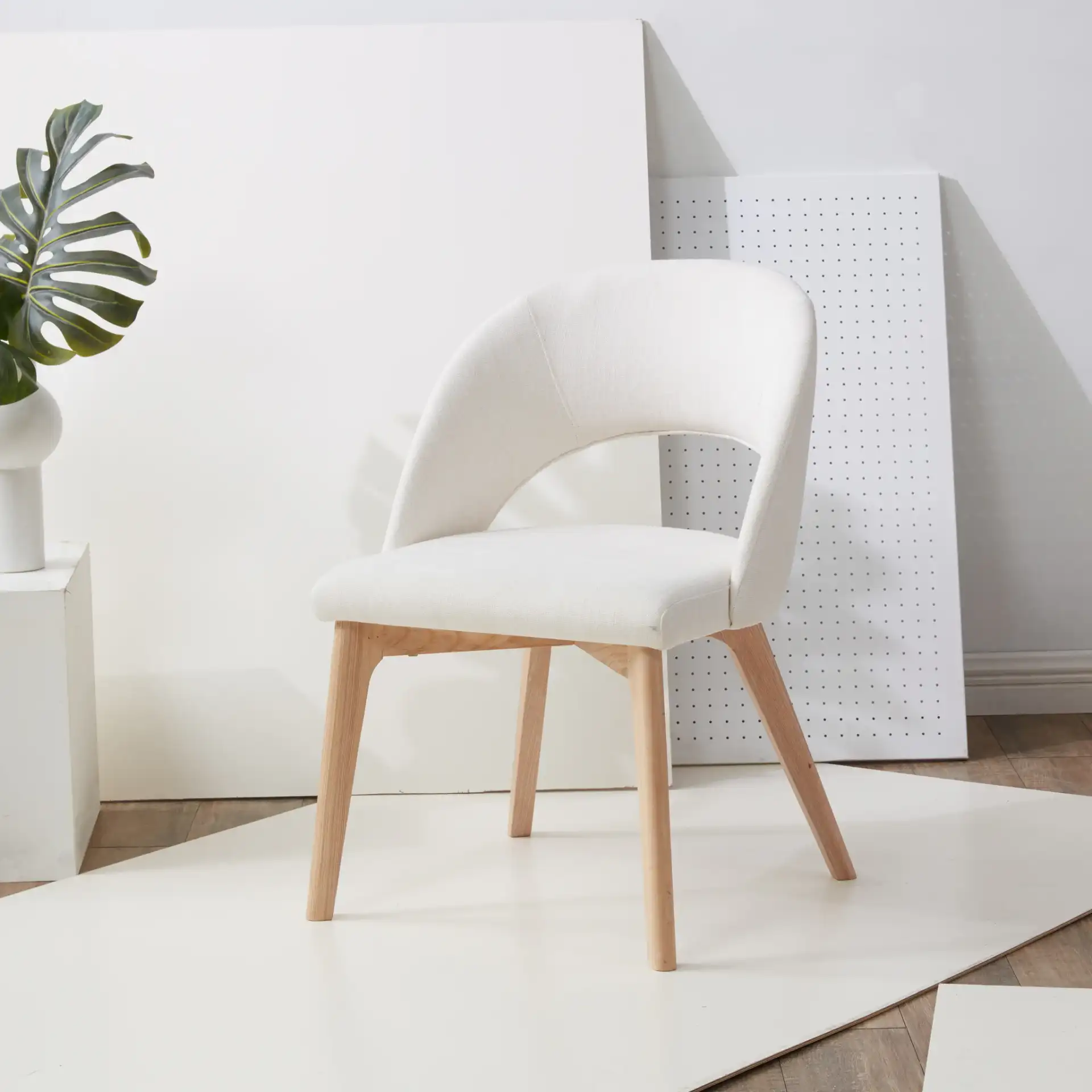 Rowland Linen Dining Chair in Gray / Black in a styled room