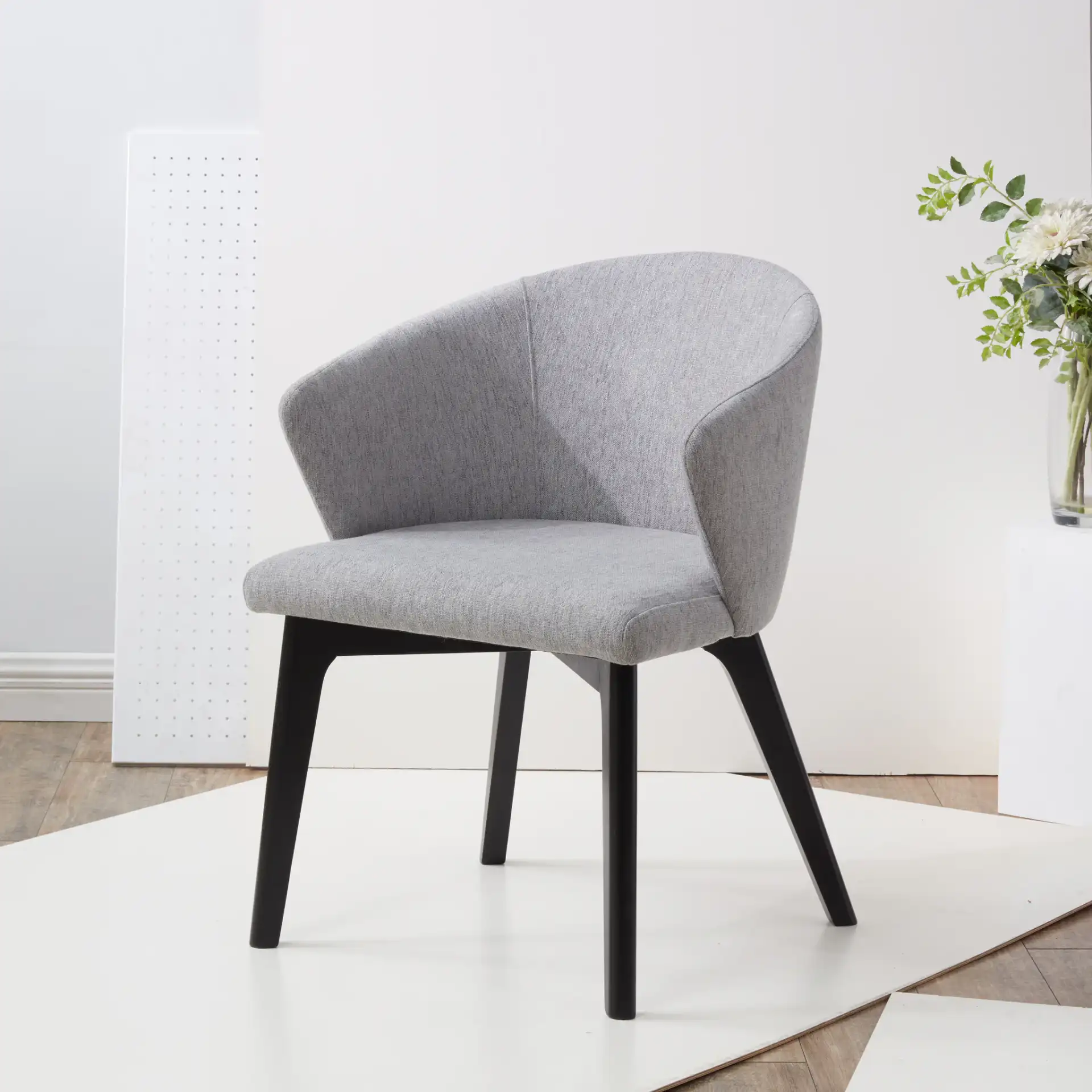 Wynonna Linen Dining Chair in Gray / Black in a styled room