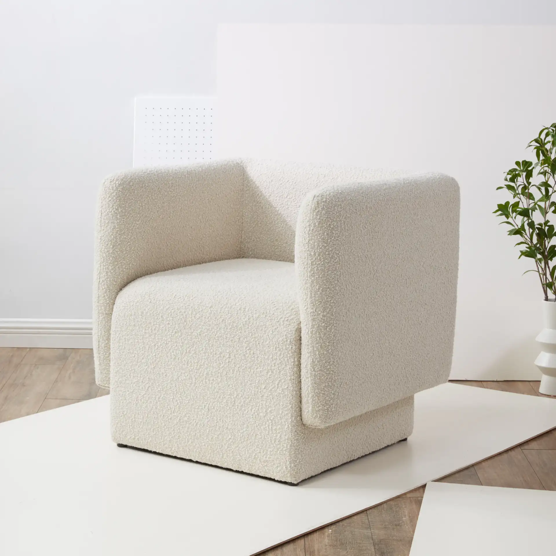 Nene Boucle Barrel Back Chair in Cream in a styled room