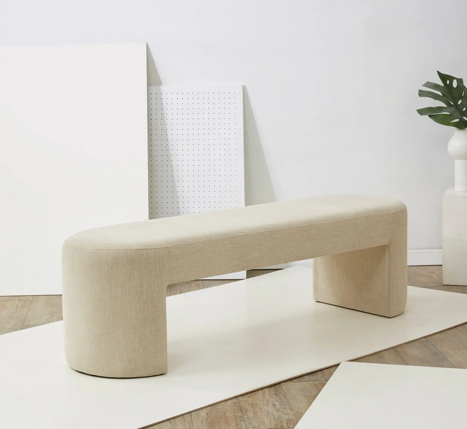 Dallyce Upholstered Bench in Beige in a styled room