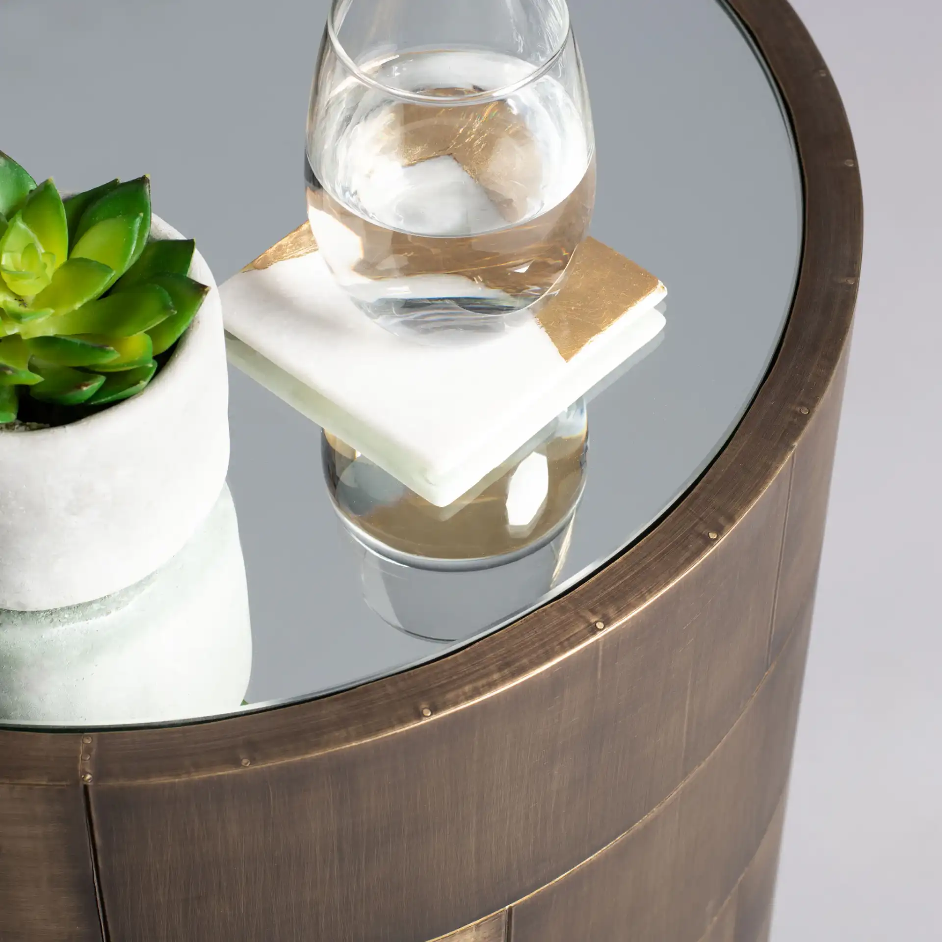 Florencia Round Side Table in Brass in a styled room