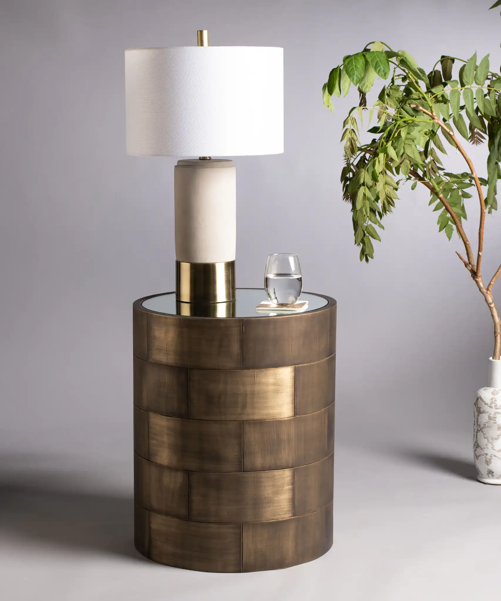Florencia Round Side Table in Brass in a styled room