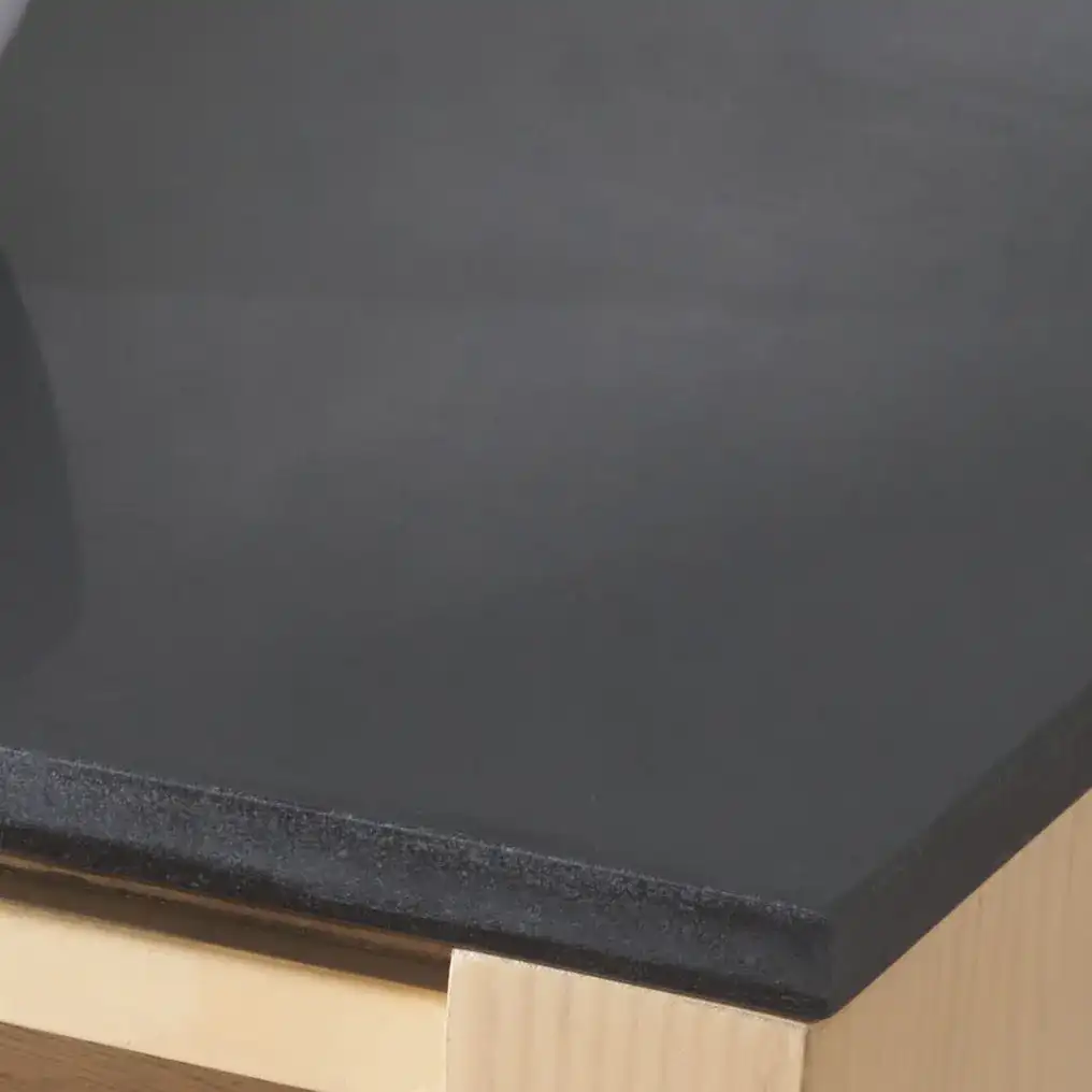 Abbianna Marble Top Nightstand in Natural / Black in a styled room
