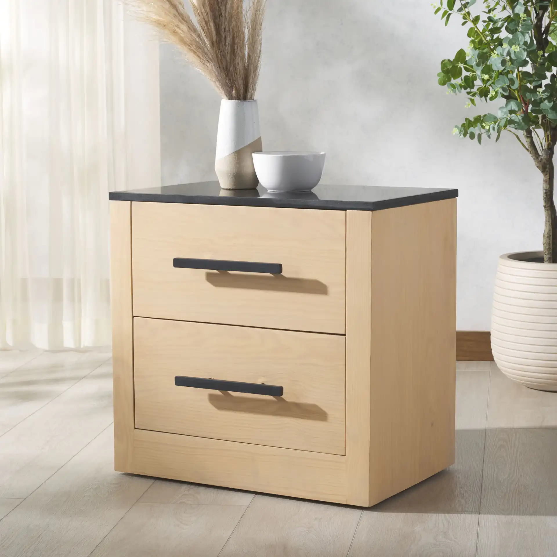 Abbianna Marble Top Nightstand in Natural / Black in a styled room