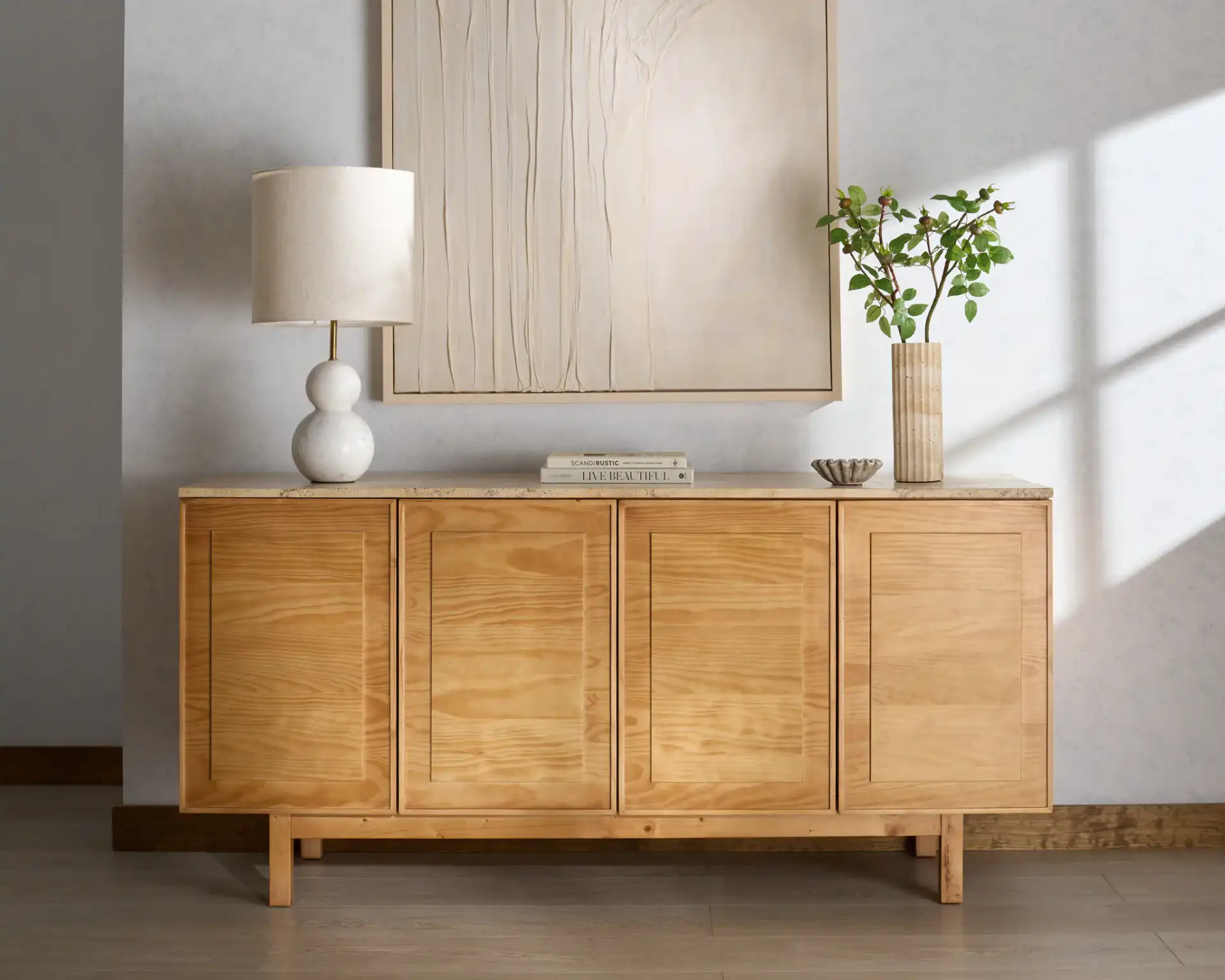 Debrianna Travertine Sideboard in Natural / Travertine in a styled room