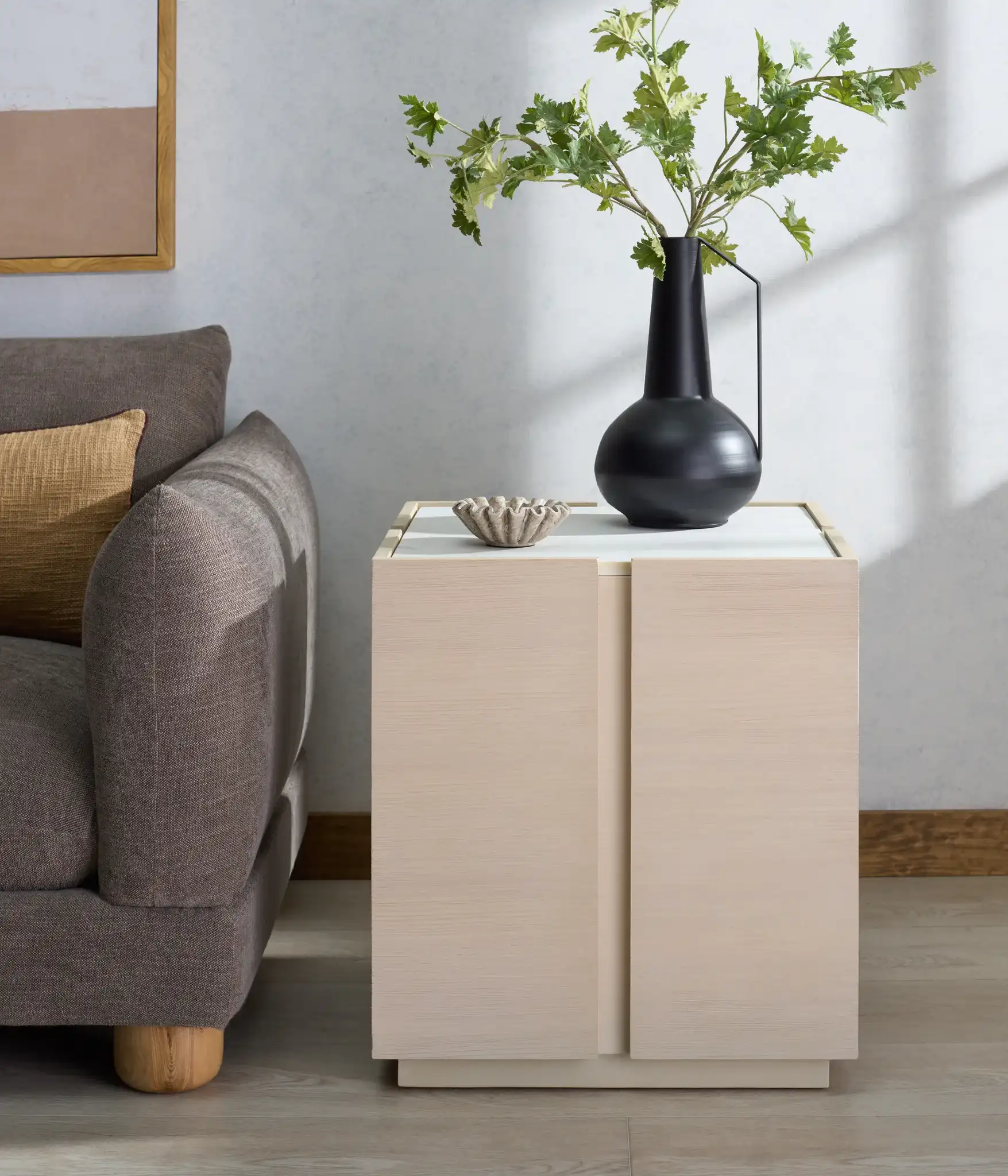 Alanabella Marble Square Accent Table in Sand / White in a styled room
