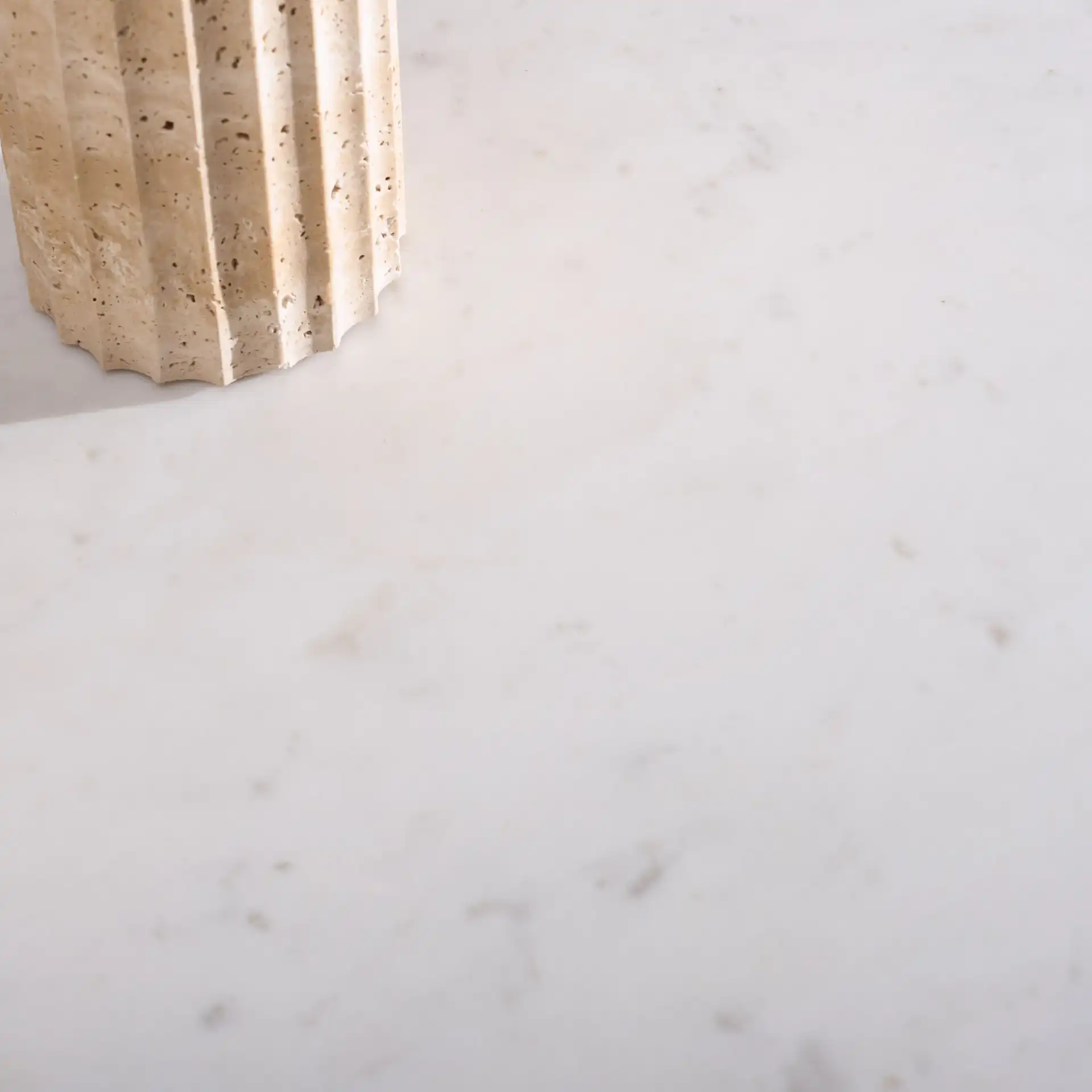 Alanabella Marble Rectangular Coffee Table in Sand / White in a styled room