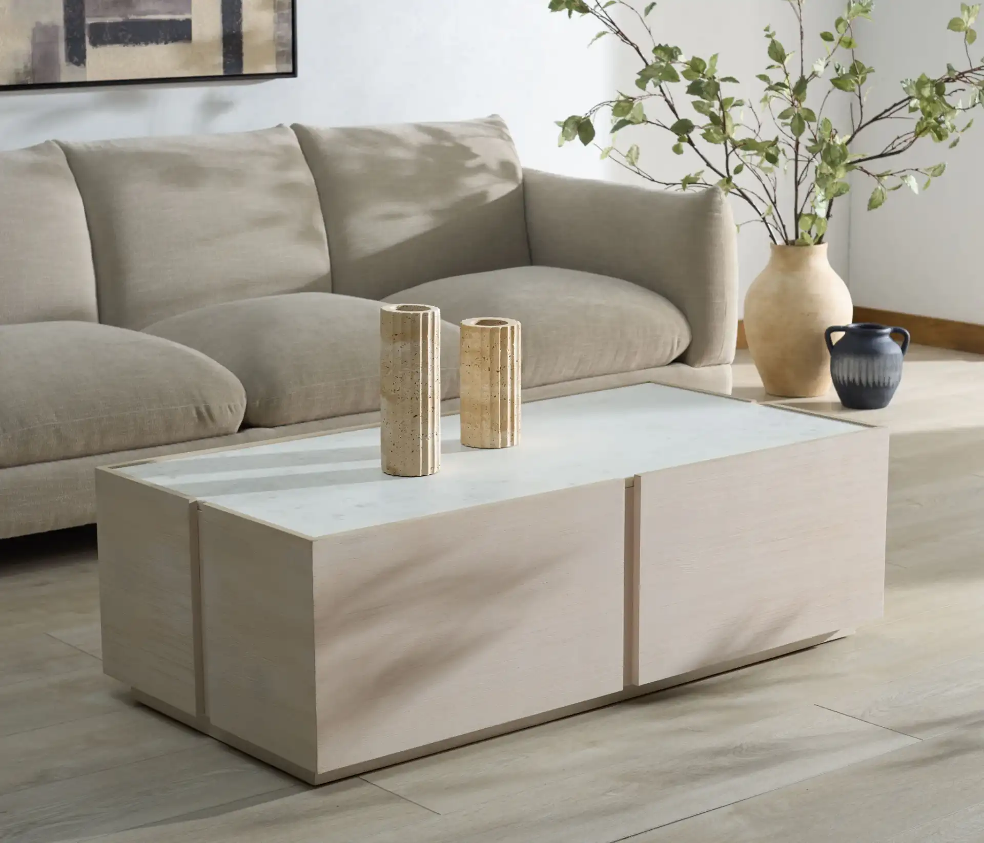 Alanabella Marble Rectangular Coffee Table in Sand / White in a styled room