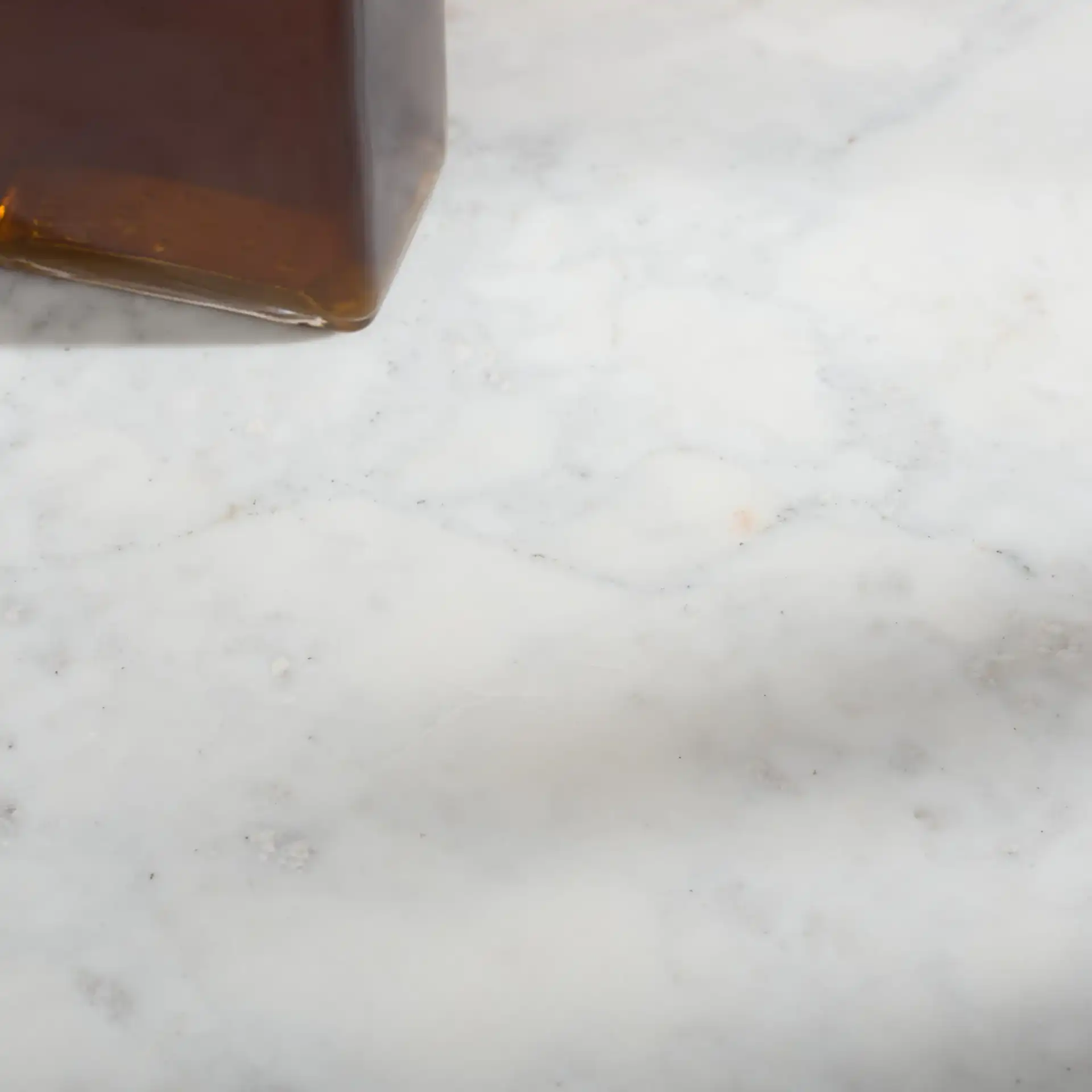 Alanabella Marble Bar Cabinet in Sand / White in a styled room