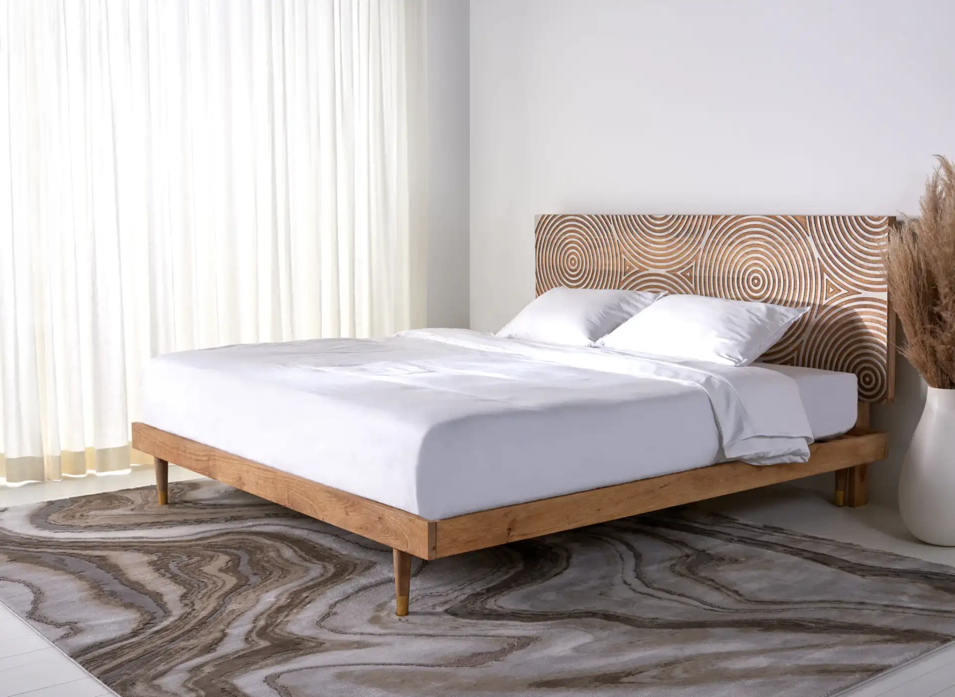 Dalvin Wood Platform Bed in Natural in a styled room