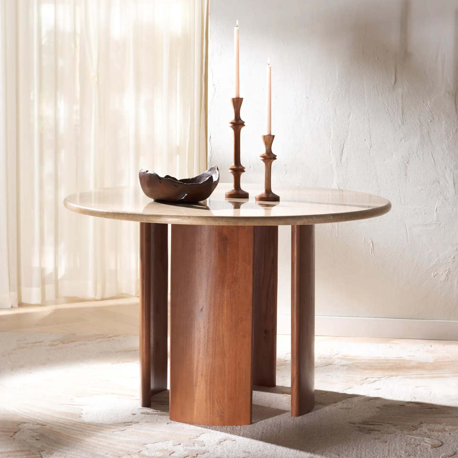 Trinsly Travertine Dining Table in Natural / Travertine in a styled room