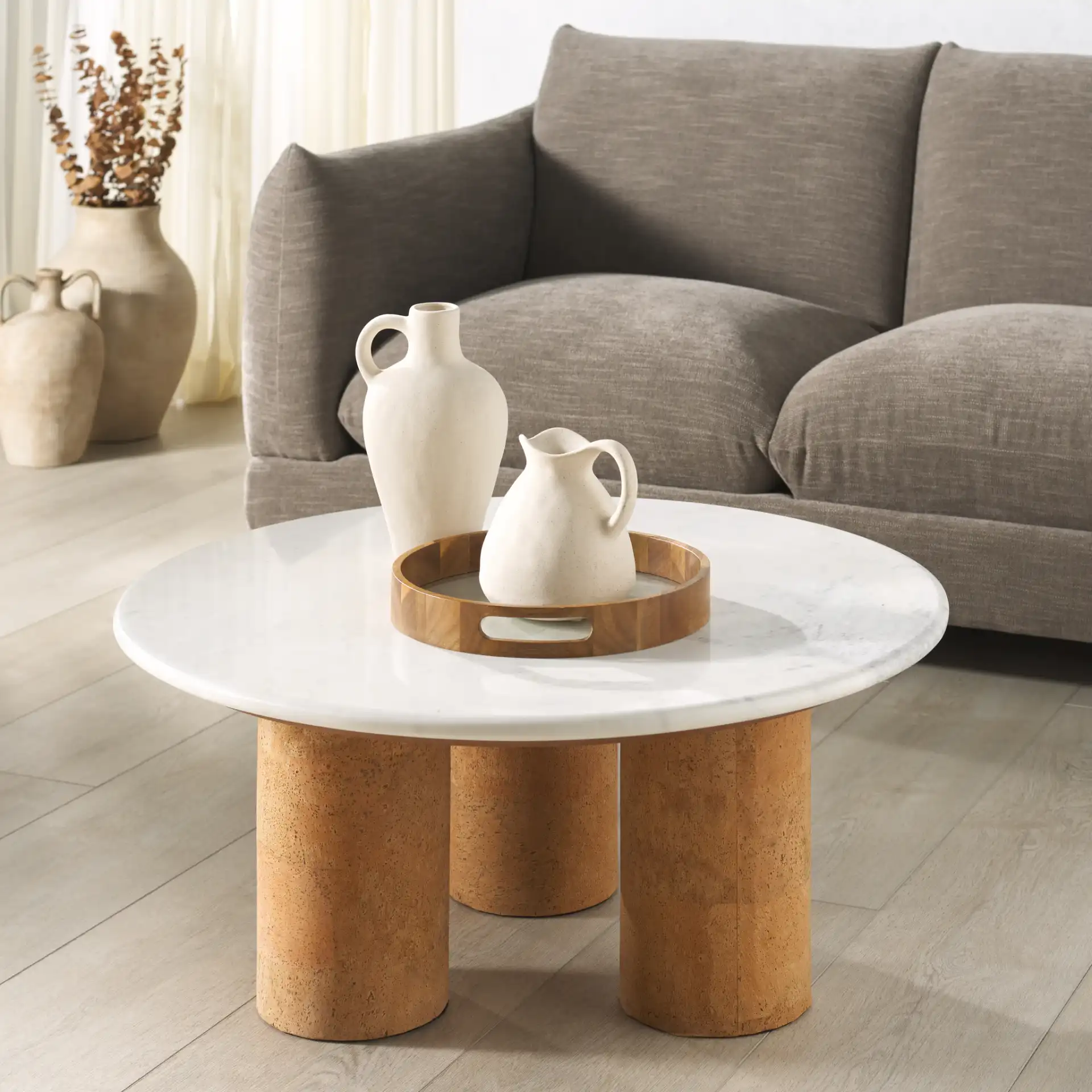 Marilynn Cork Coffee Table in White / Cork in a styled room