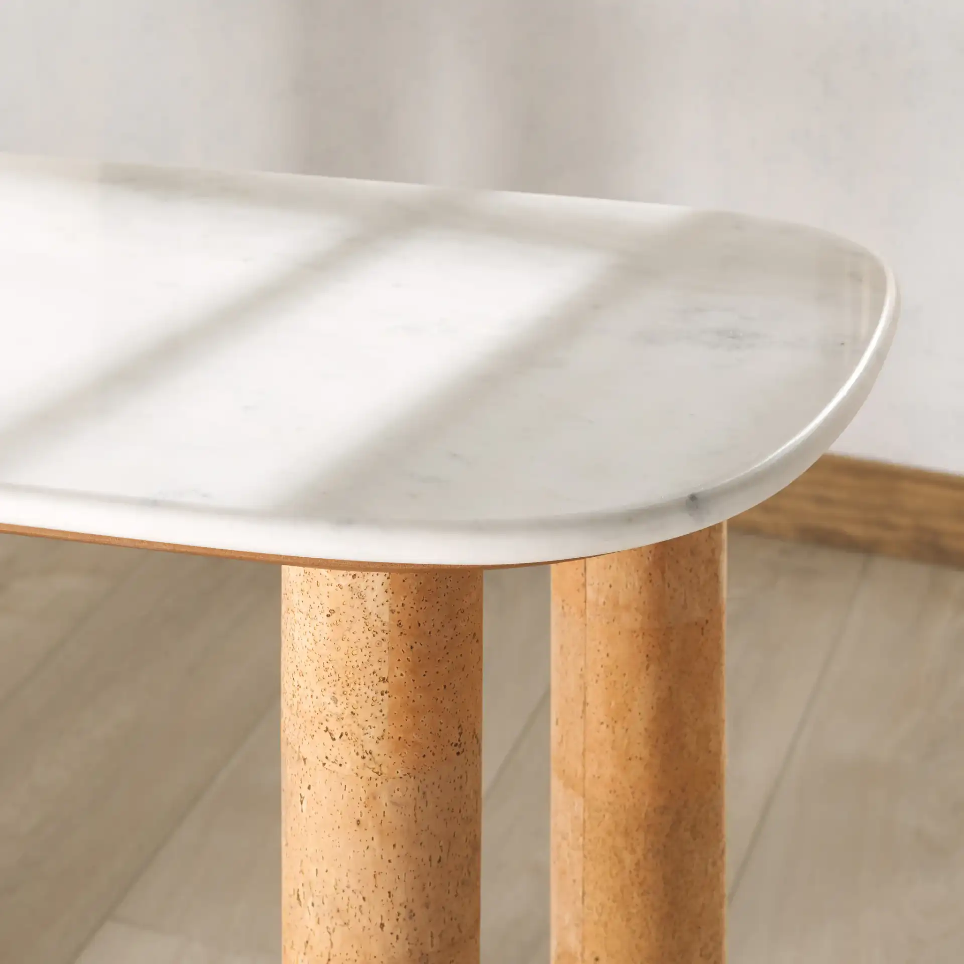 Marilynn Cork Console Table in White / Cork in a styled room
