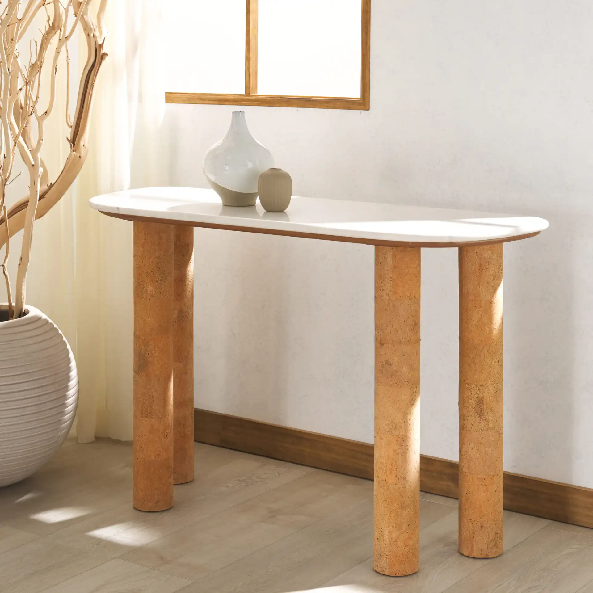 Marilynn Cork Console Table in White / Cork in a styled room