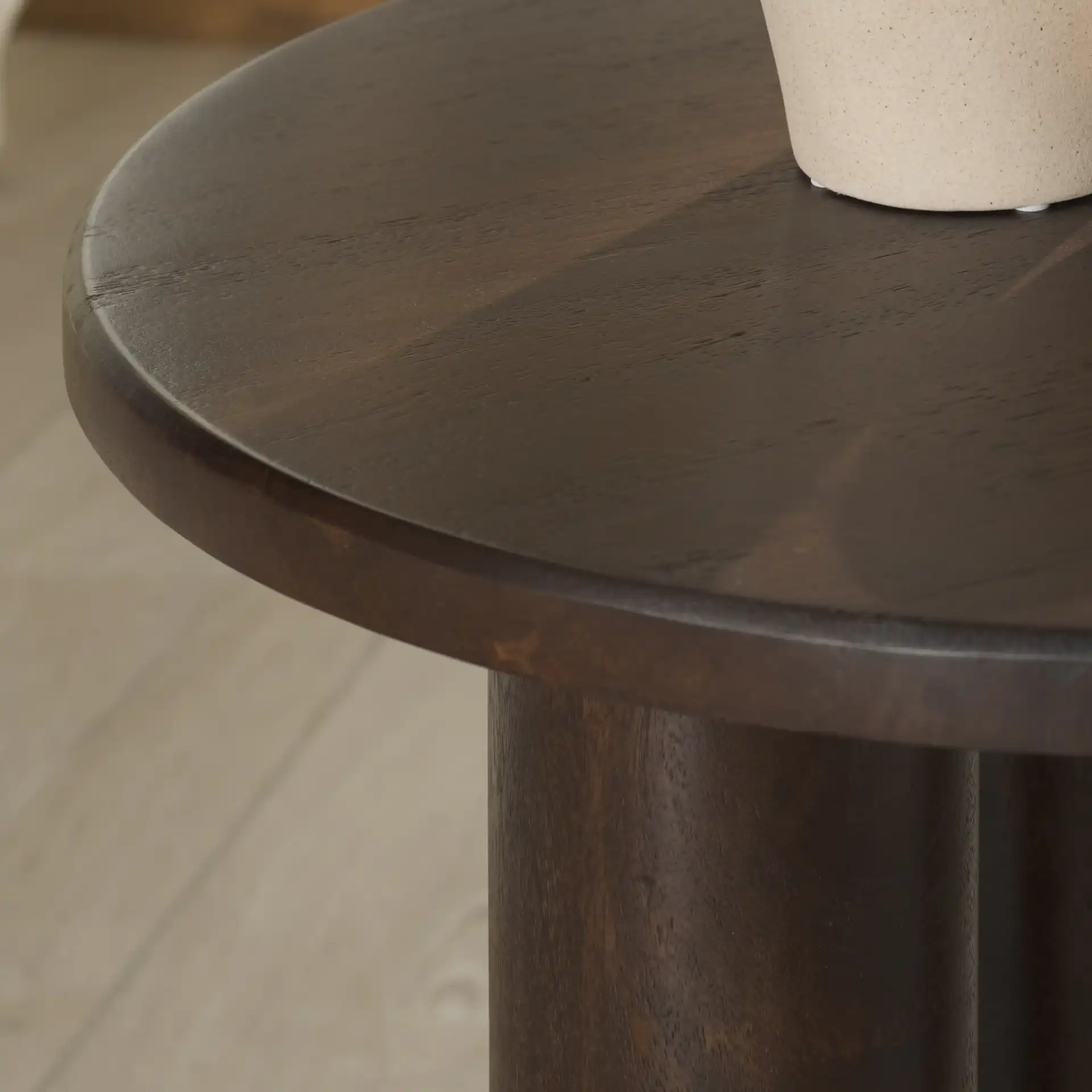 Jennamira Wood Accent Table in Dark Brown in a styled room