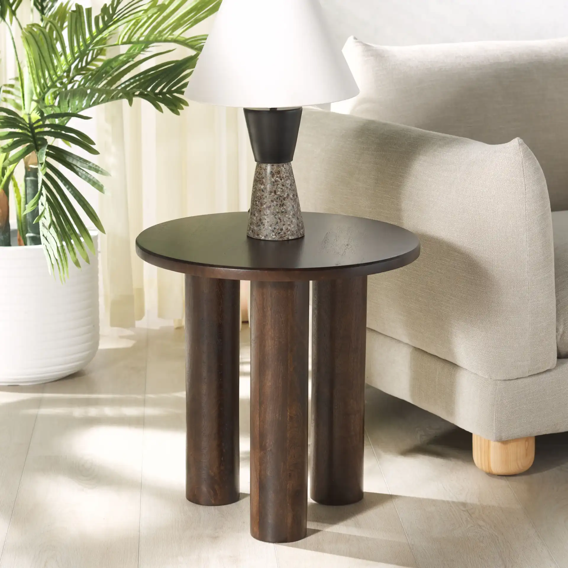 Jennamira Wood Accent Table in Dark Brown in a styled room