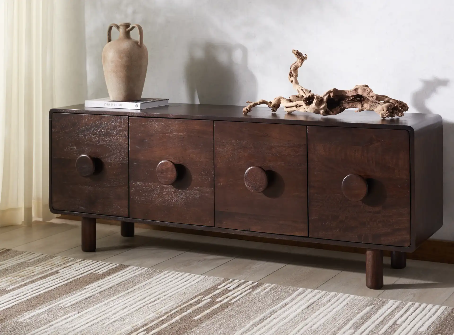Jennamira Wood Sideboard in Dark Brown in a styled room
