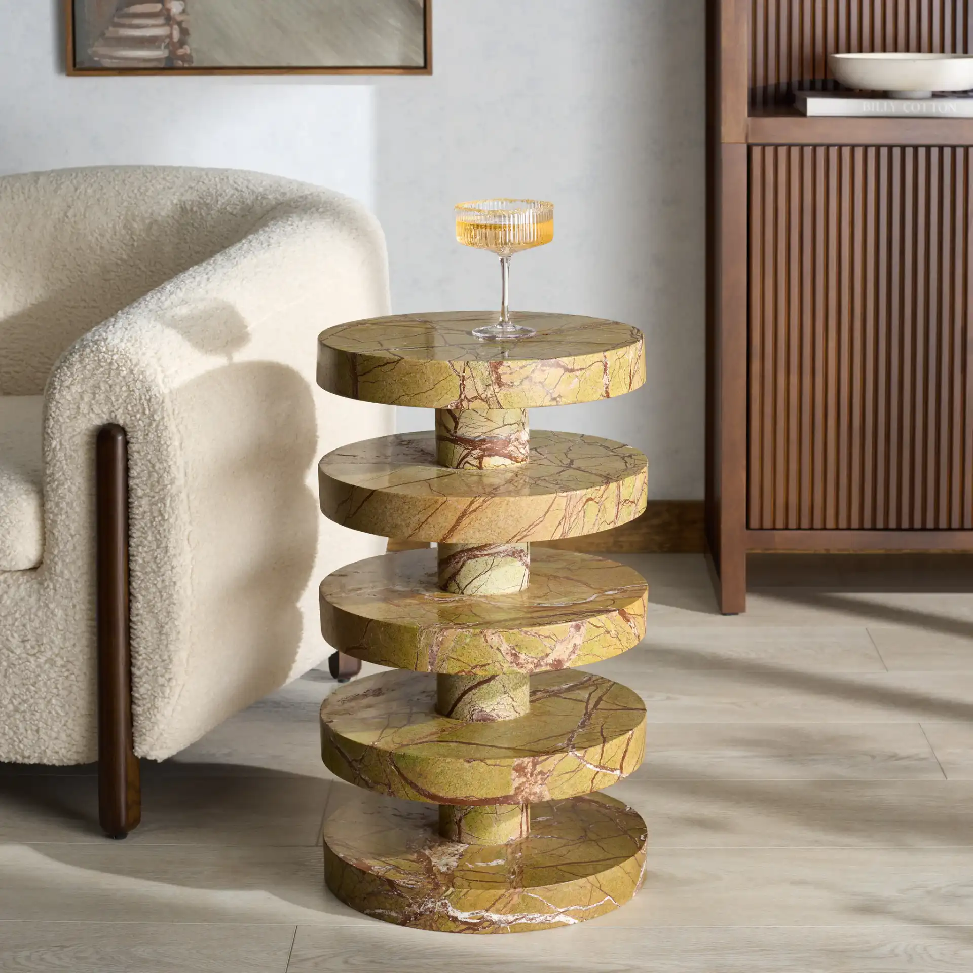Danny Round Marble Accent Table in Brown / Green in a styled room