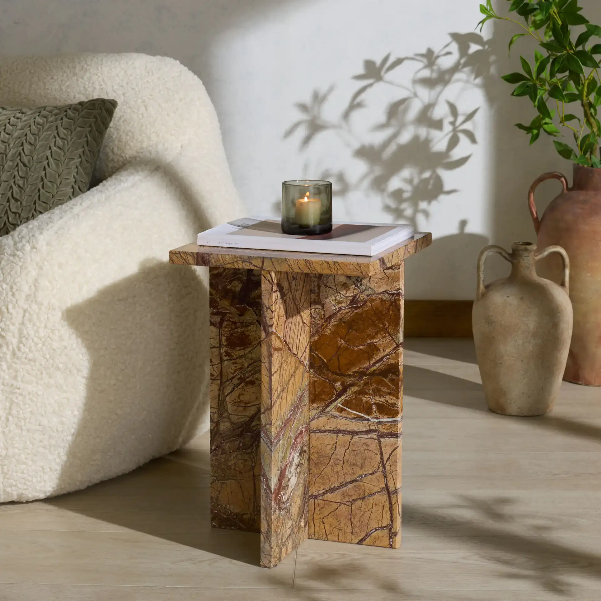 Adriano 12-Inch Marble Accent Table in Brown / Beige in a styled room