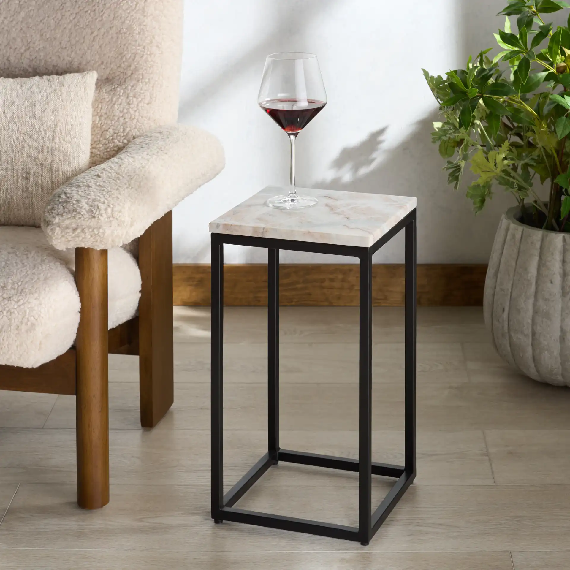 Macklyn Square Marble Top Accent Table in Light Brown / Black in a styled room
