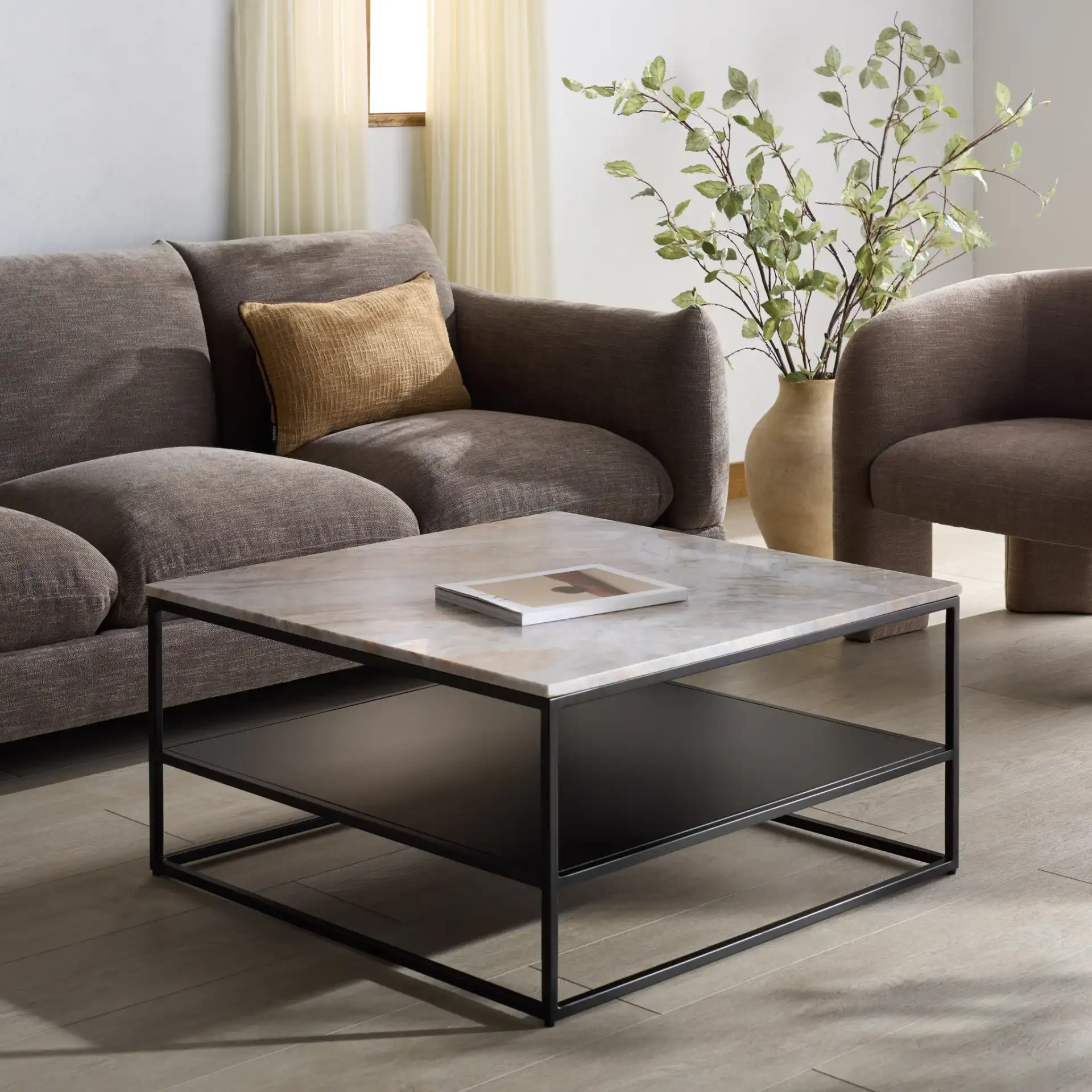 Macklyn Marble Top Coffee Table in Light Brown / Black in a styled room