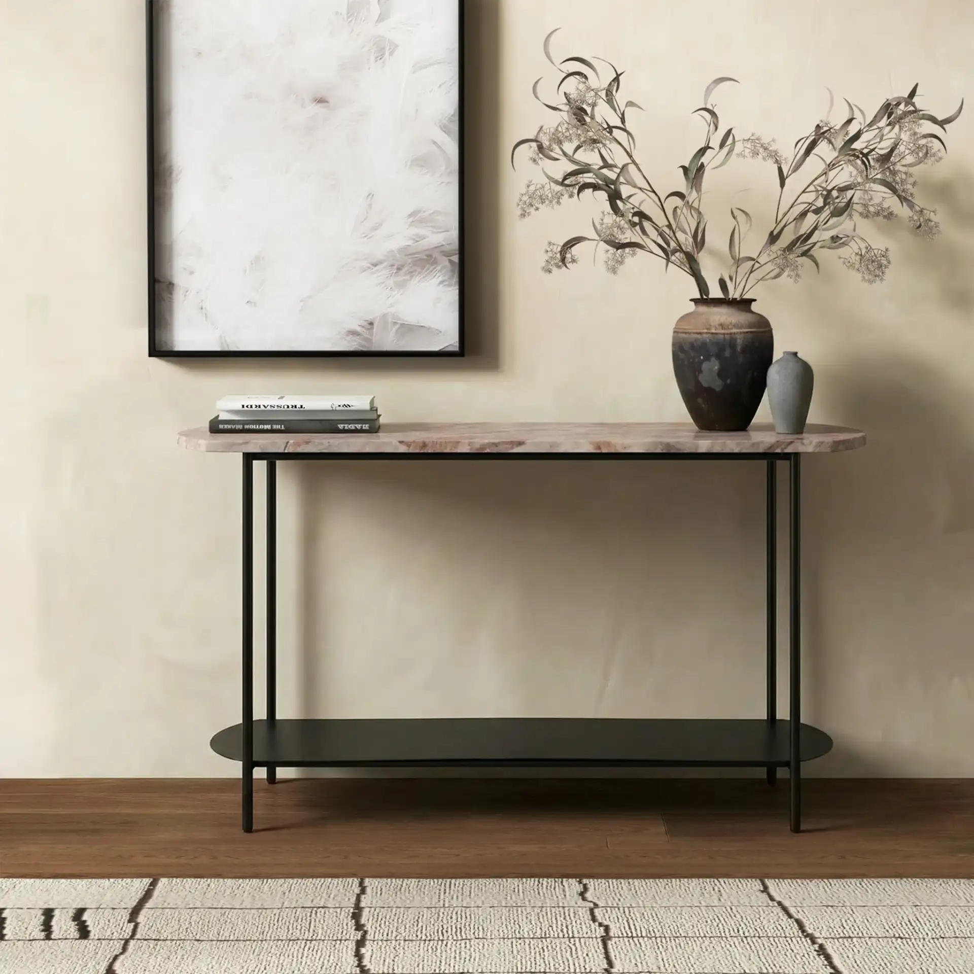 Macklyn Oval Console Table in Light Brown / Black in a styled room