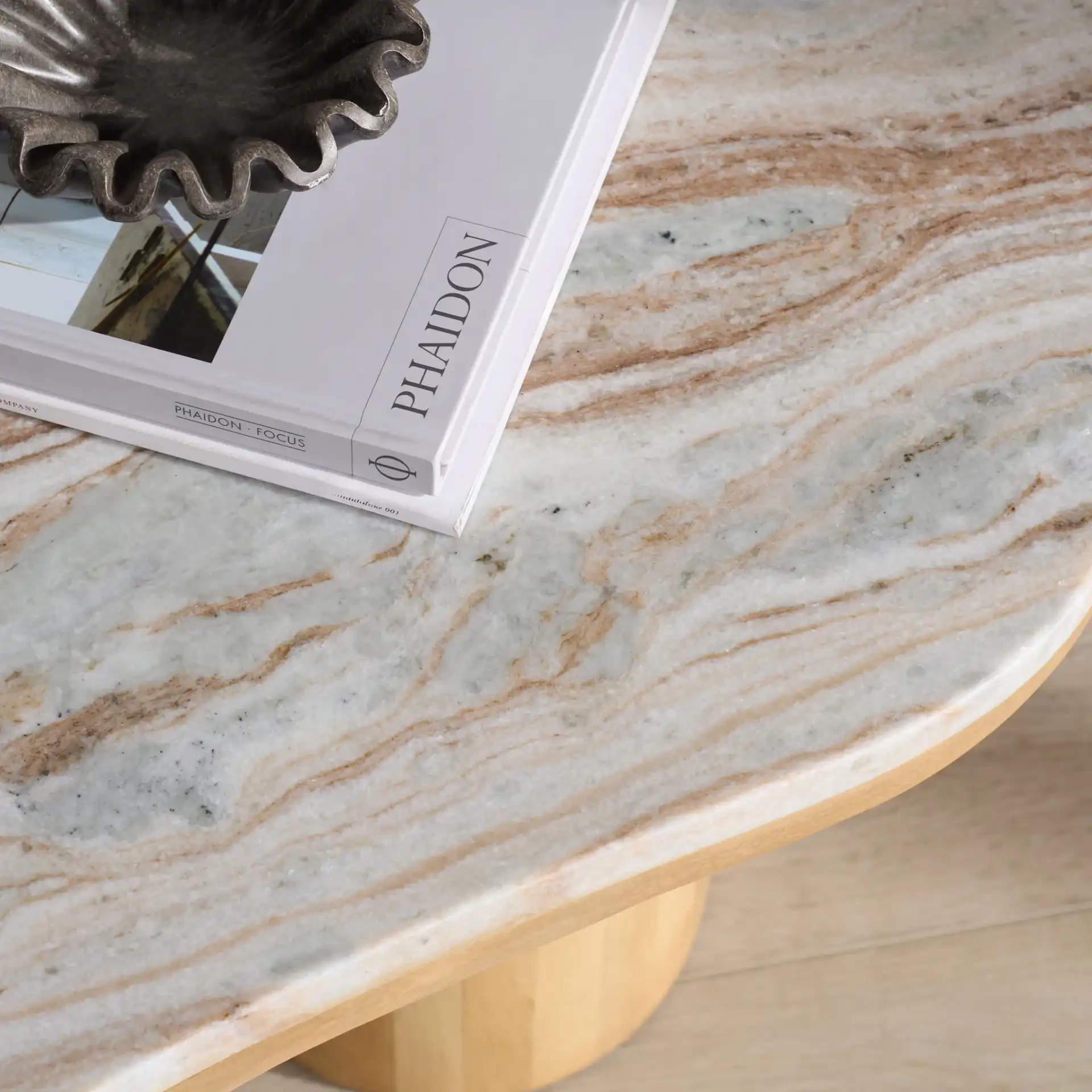 Feliciabeth Marble Coffee Table in Natural / Light Brown in a styled room