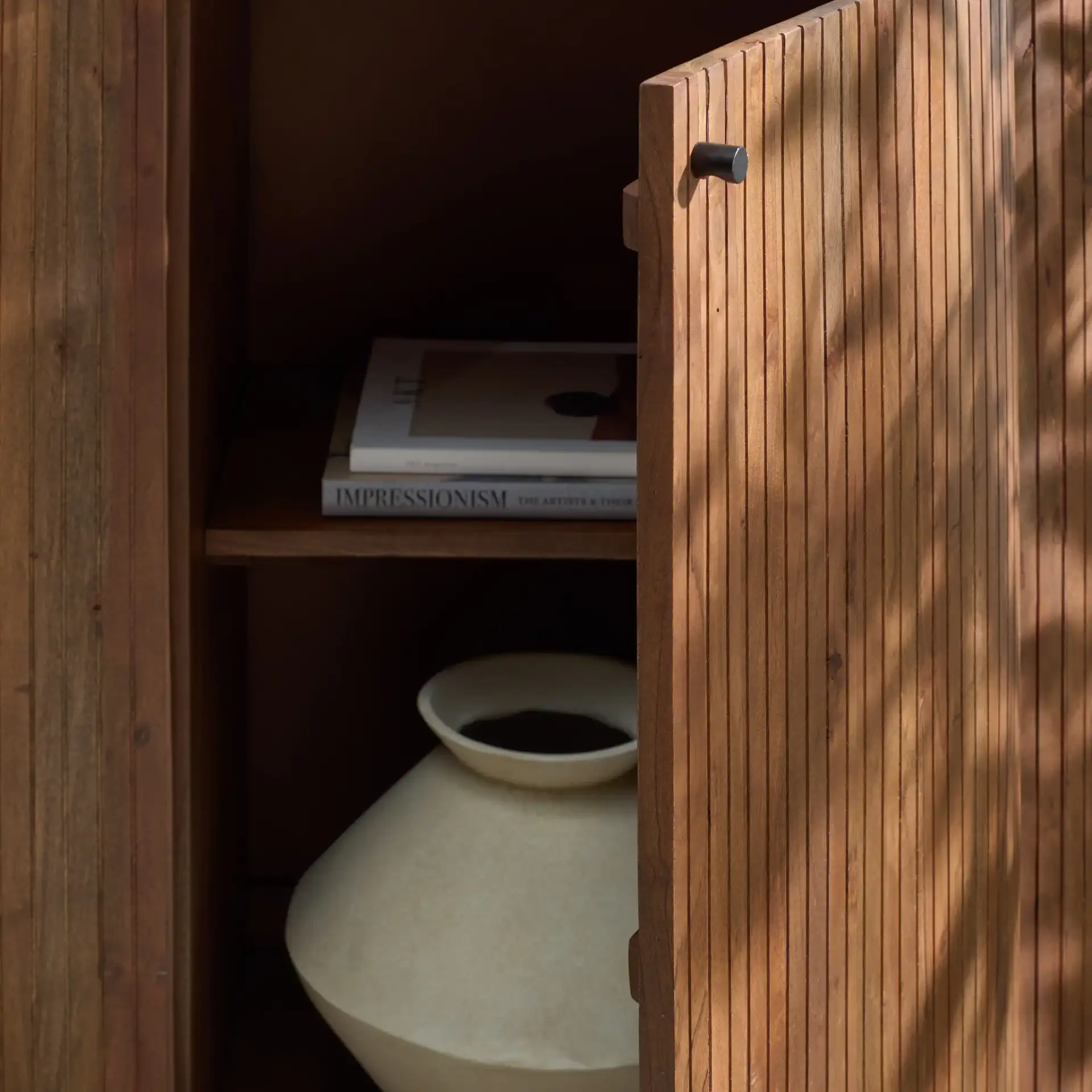 Jamilah Marble Top Chest in Brown in a styled room