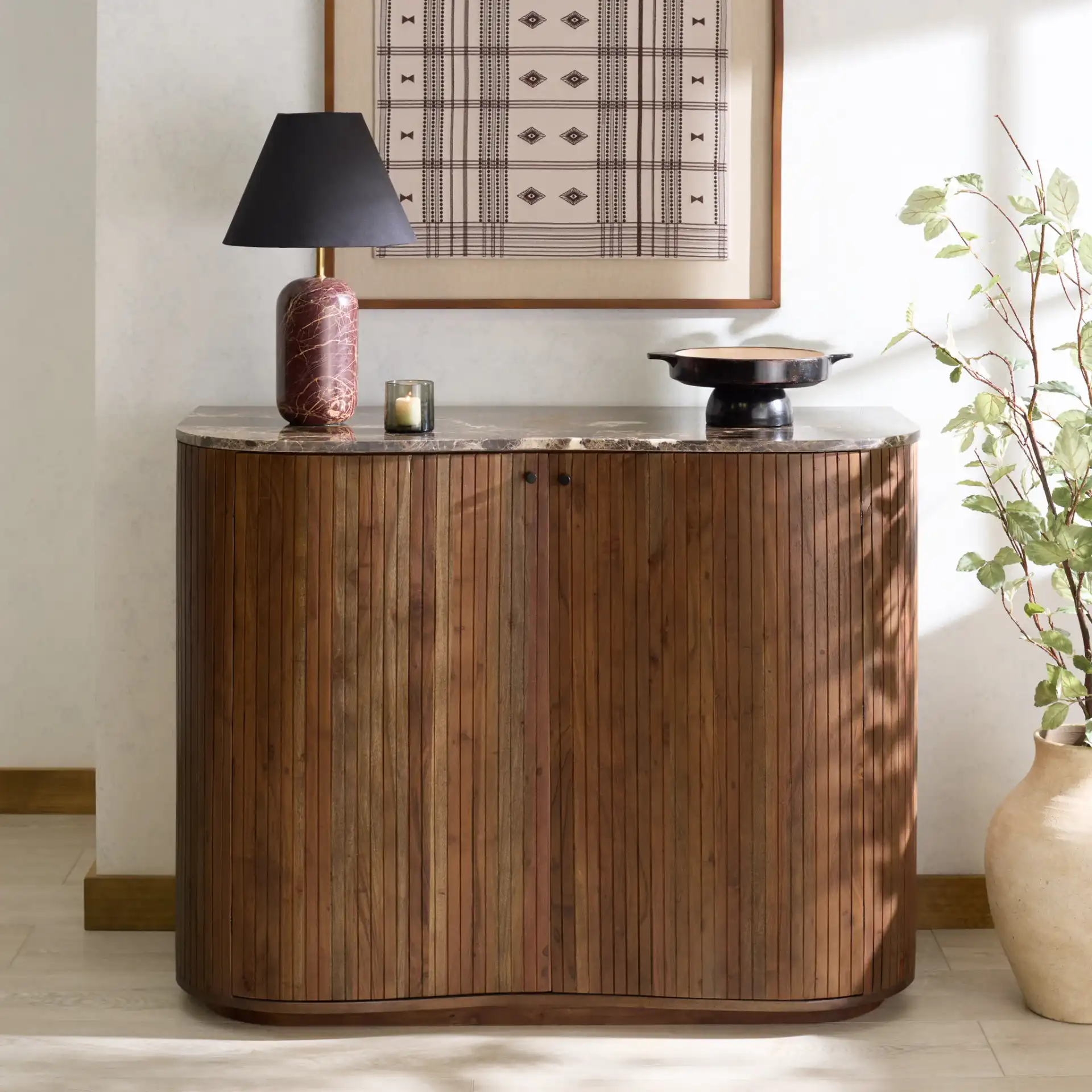 Jamilah Marble Top Chest in Brown in a styled room