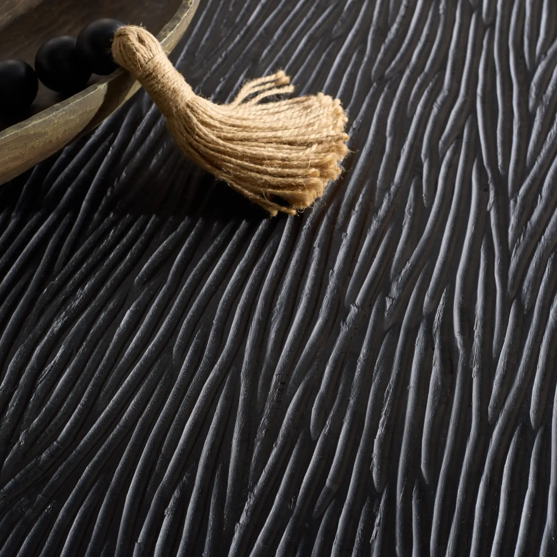 Petraclara Wood Coffee Table in Black in a styled room