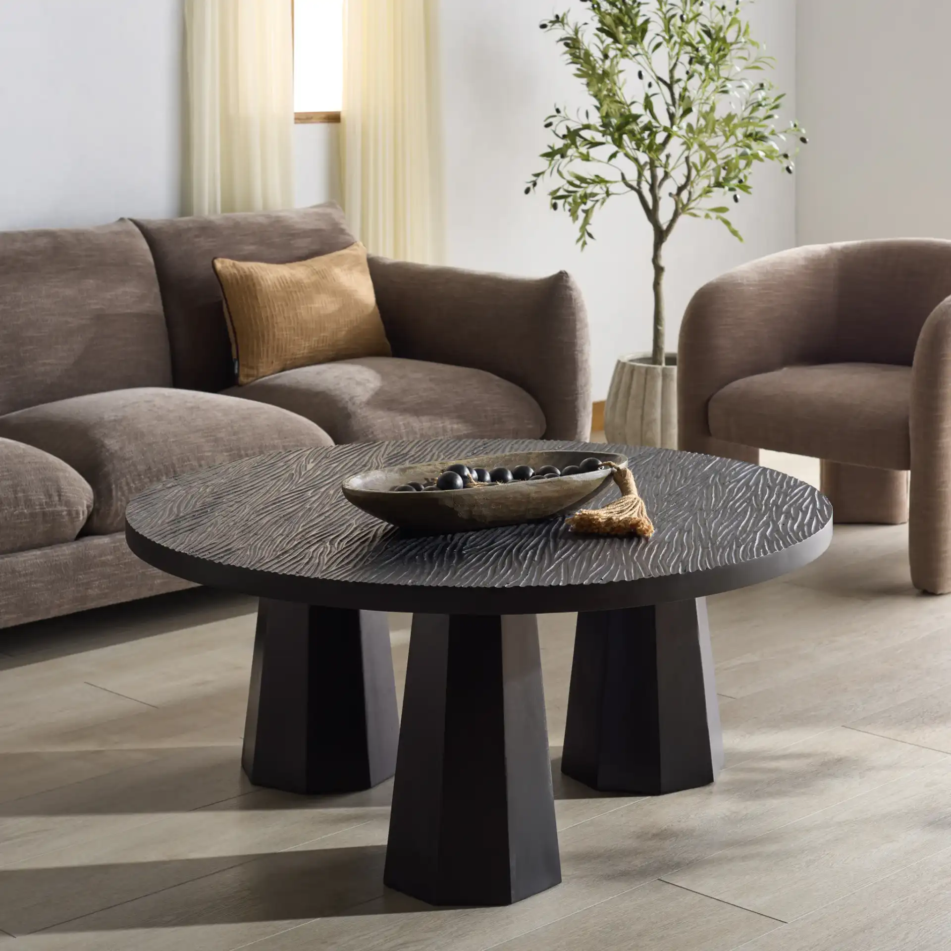 Petraclara Wood Coffee Table in Black in a styled room